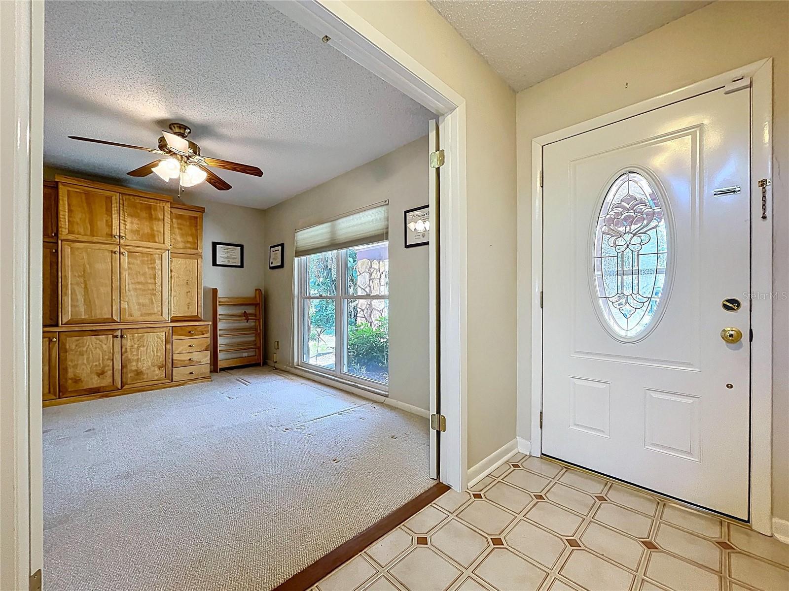 Front foyer with double-doors into office/bedroom