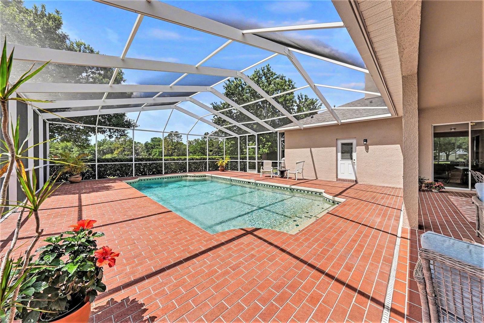 Expansive screened-in backyard