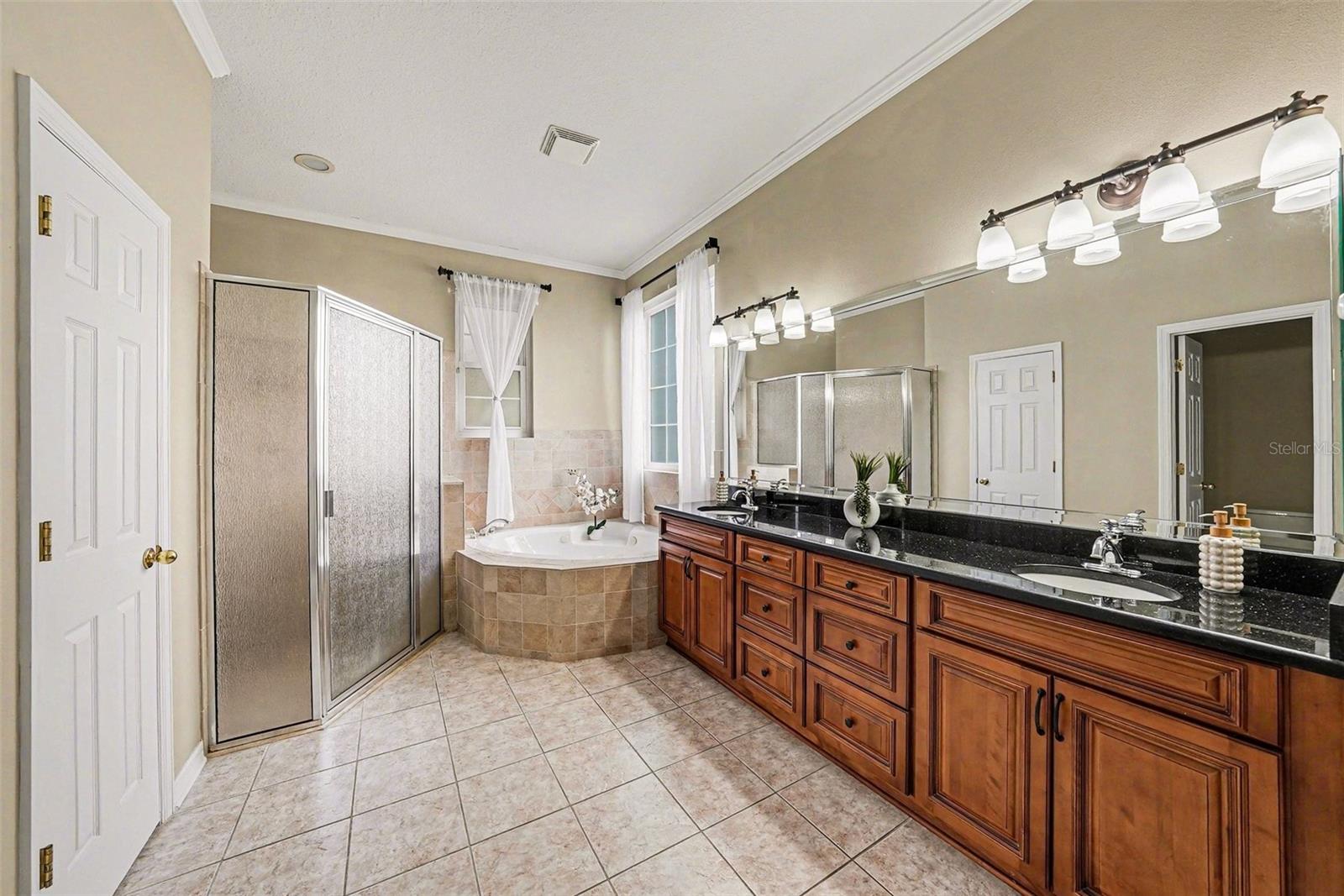 Spacious ensuite primary bathroom-dual vanities, jetted garden tub