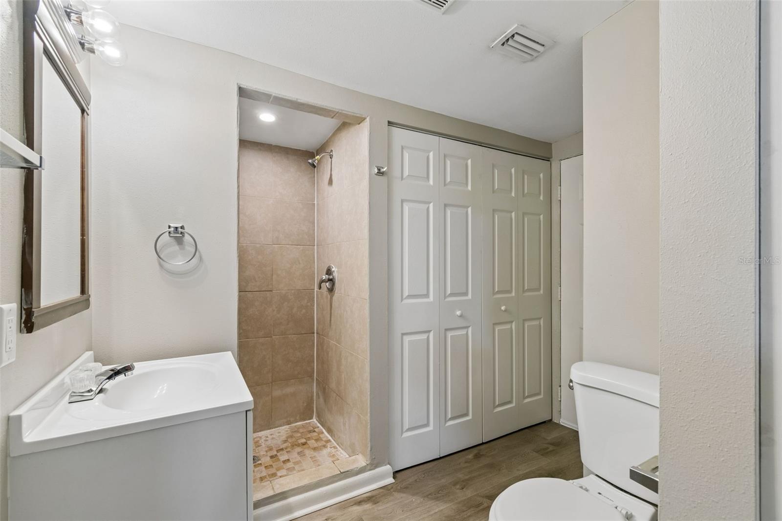 Bathroom - Utility closet inside folding doors