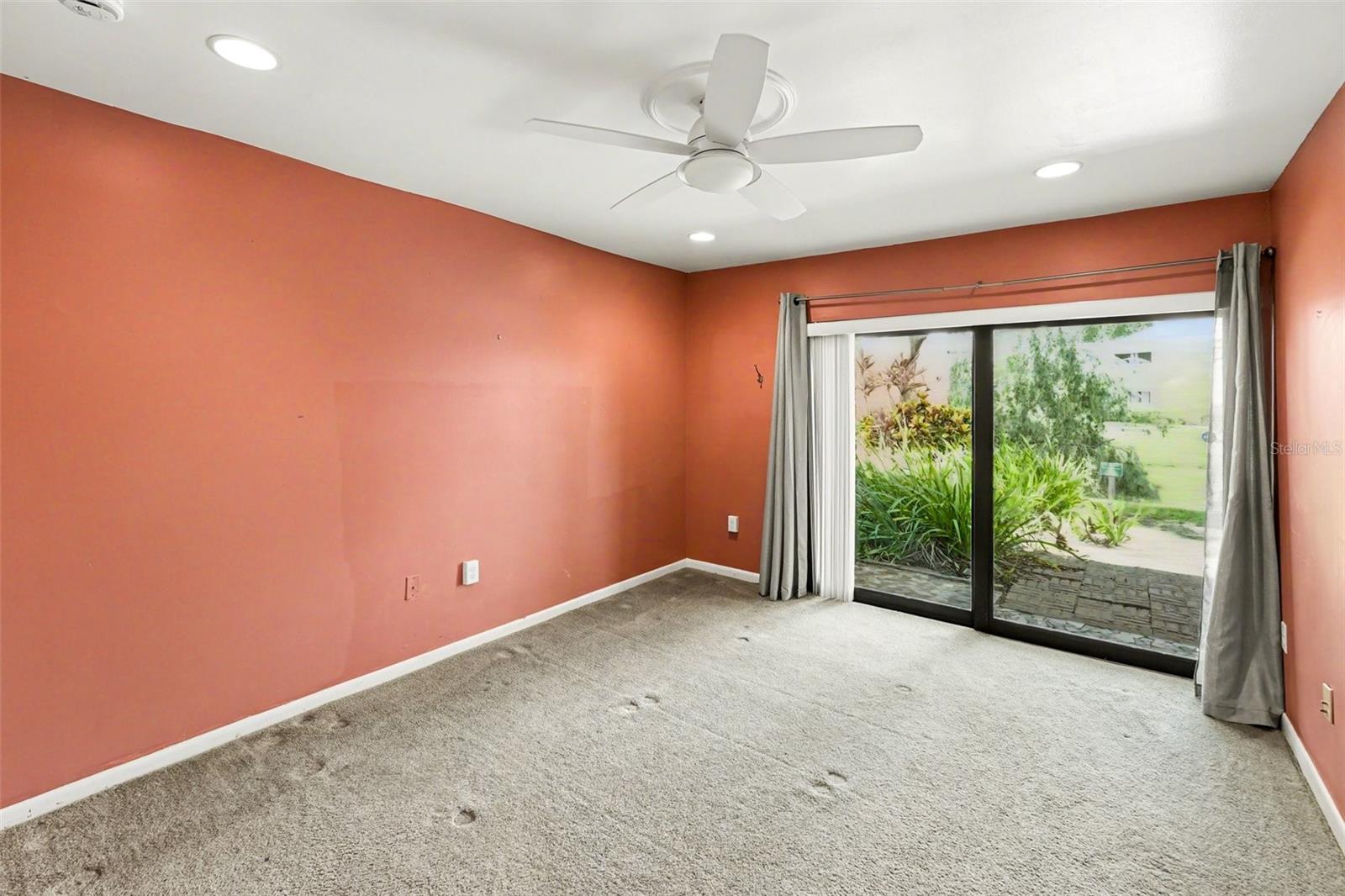 Master Bedroom (Ceiling Fan, Sliding impact resistant door to outdoor patio)