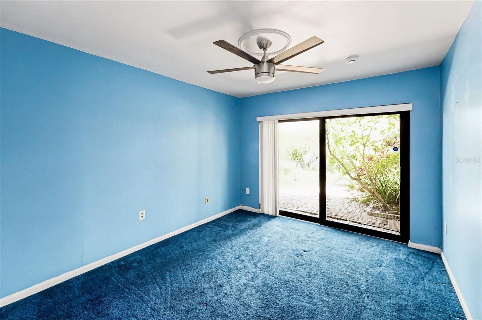 Bedroom 2 (Sliding impact resistant door to outdoor patio, Ceiling Fan)