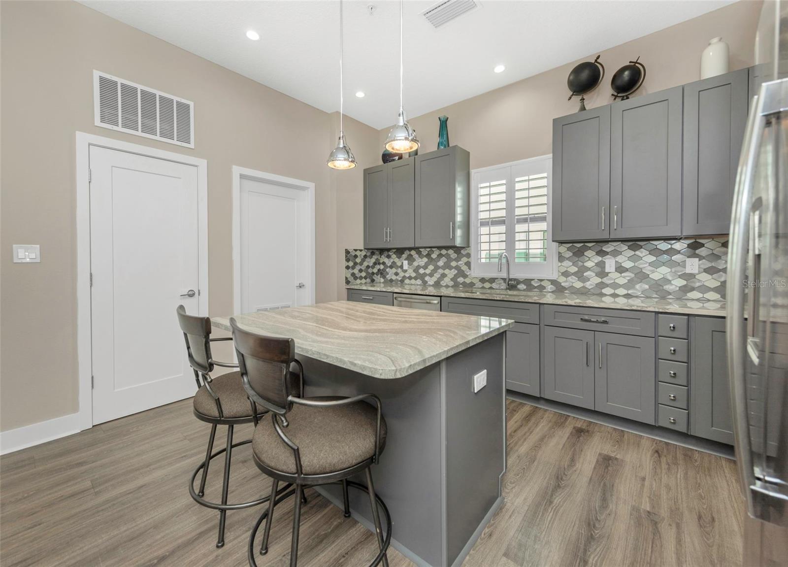 The kitchen area includes a closet pantry and a laundry room.