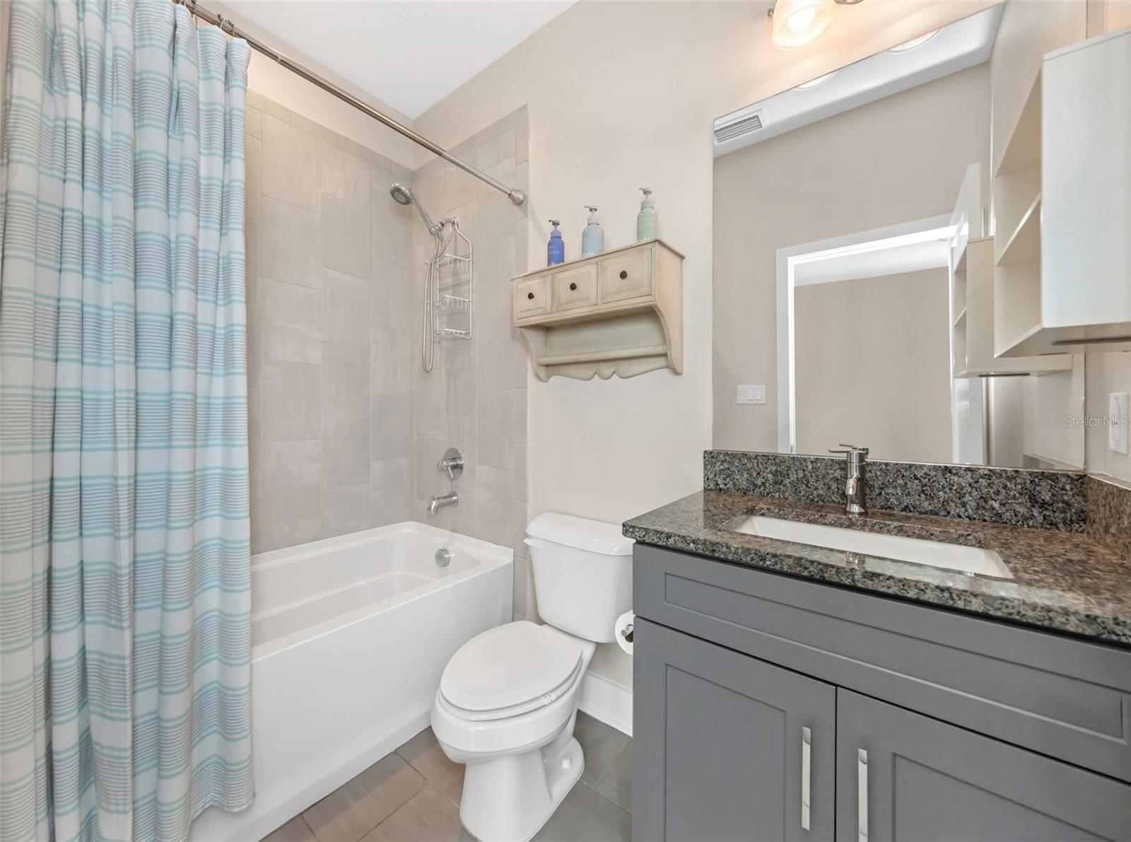 Guest Bedroom bathroom with tub / shower combination.