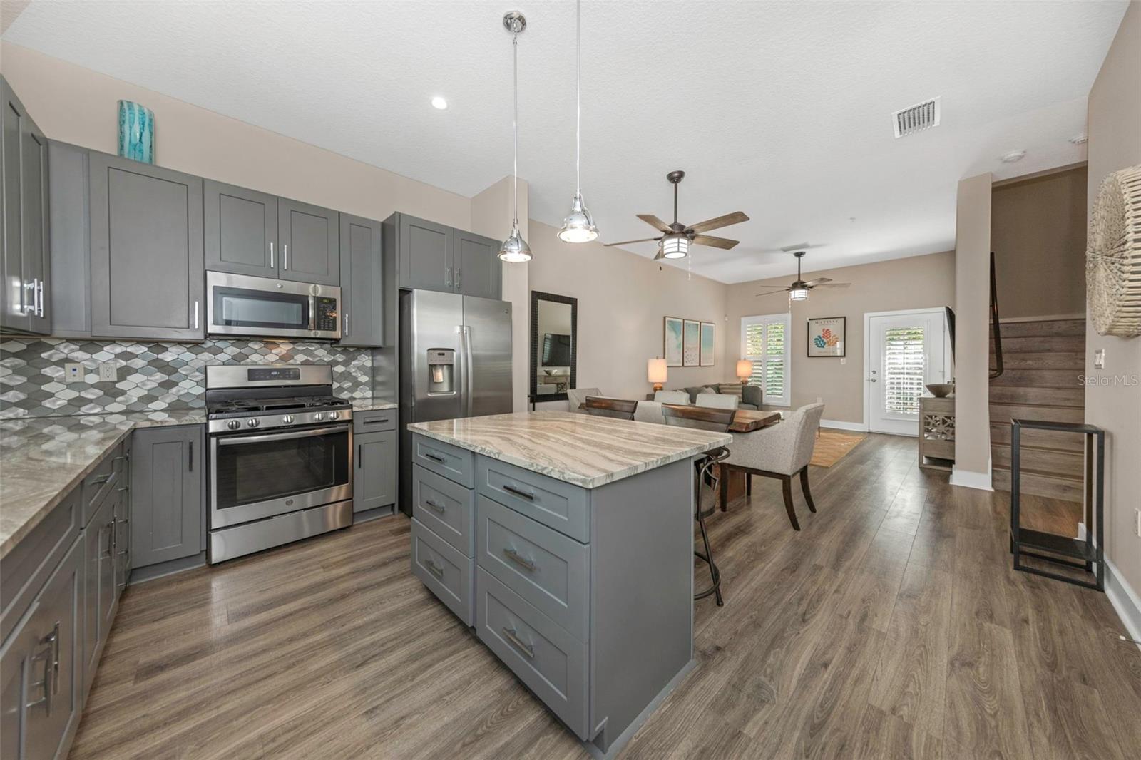 Spacious kitchen with island bar.