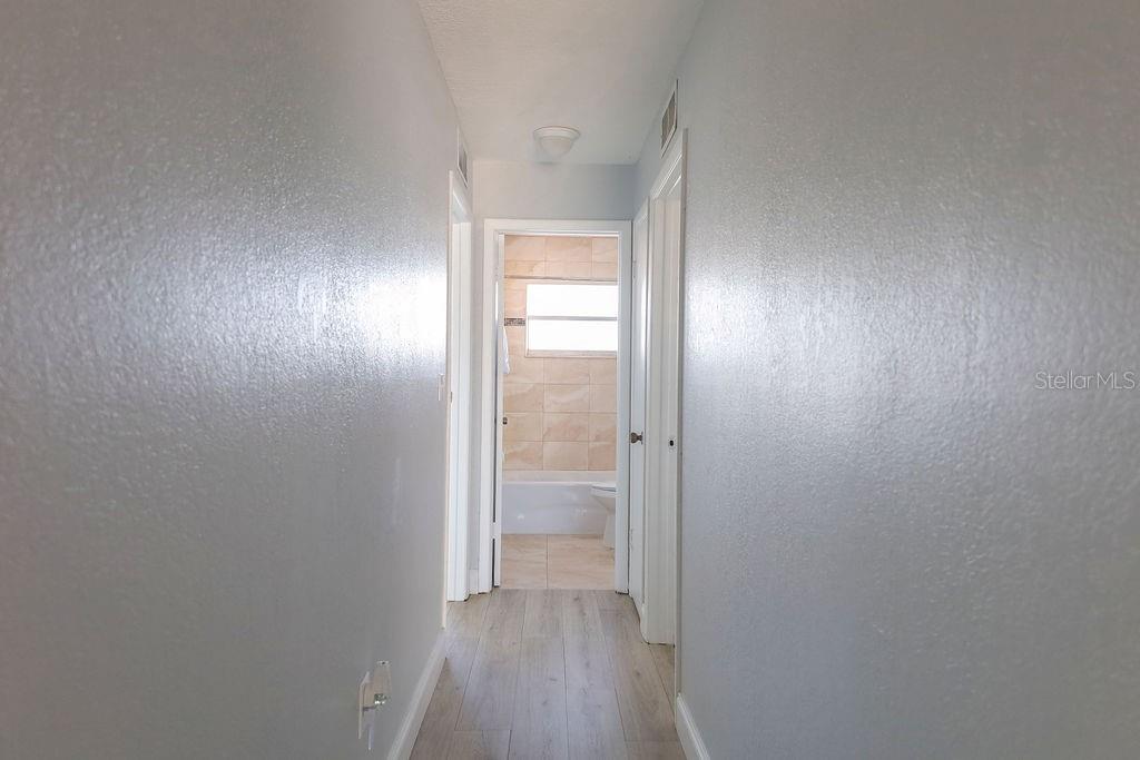 Hallway that lead to 3 of the bedrooms and the bathrooms