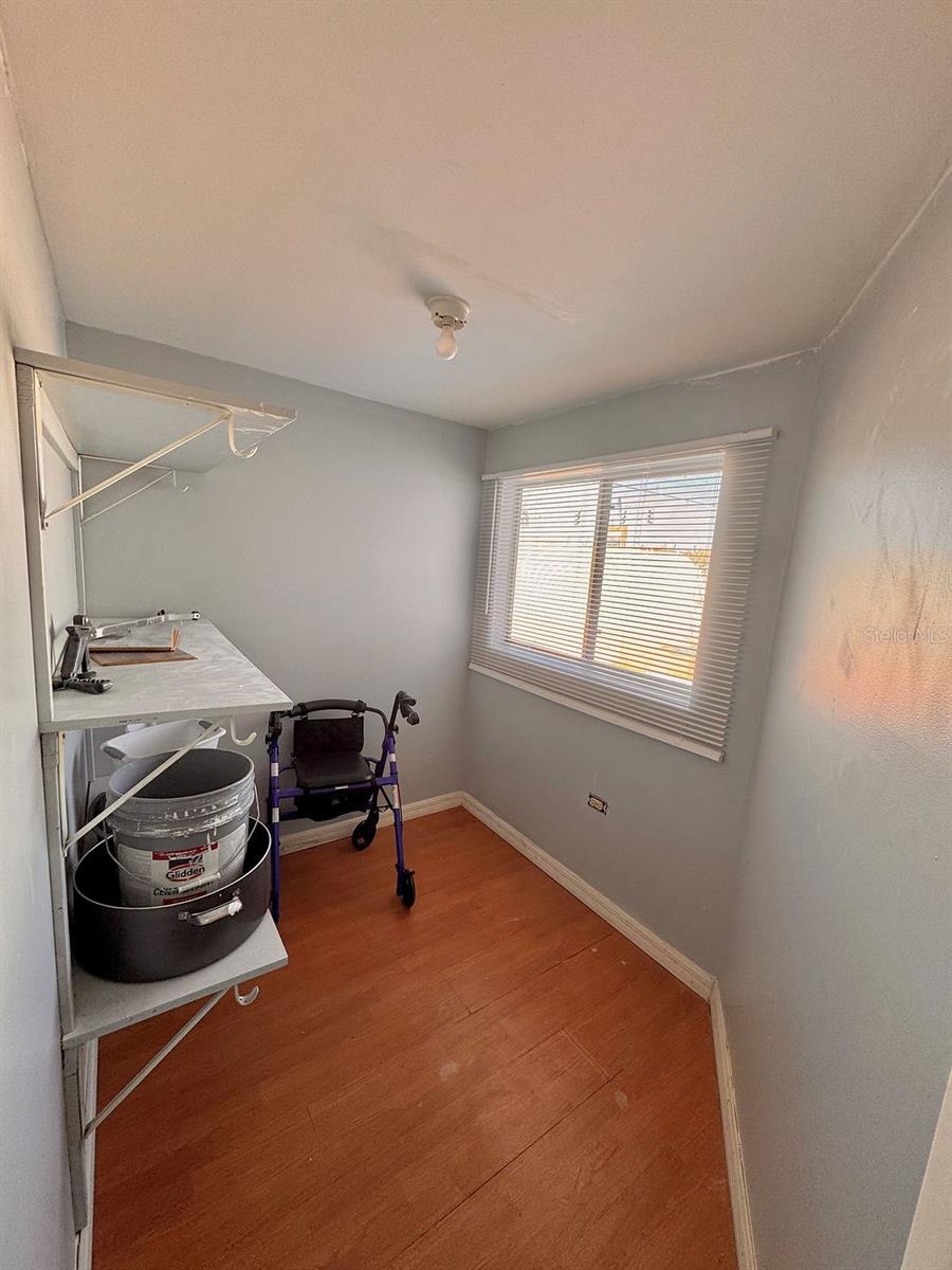 Primary bedroom walk in closet