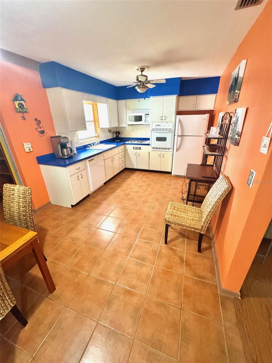 The kitchen is turn-key with cooking and dining implements