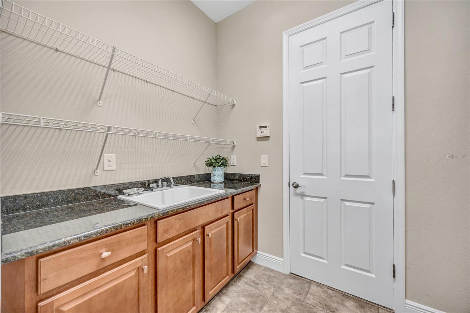 Laundry Room with Cabinet Storage and Utiltiy Sink