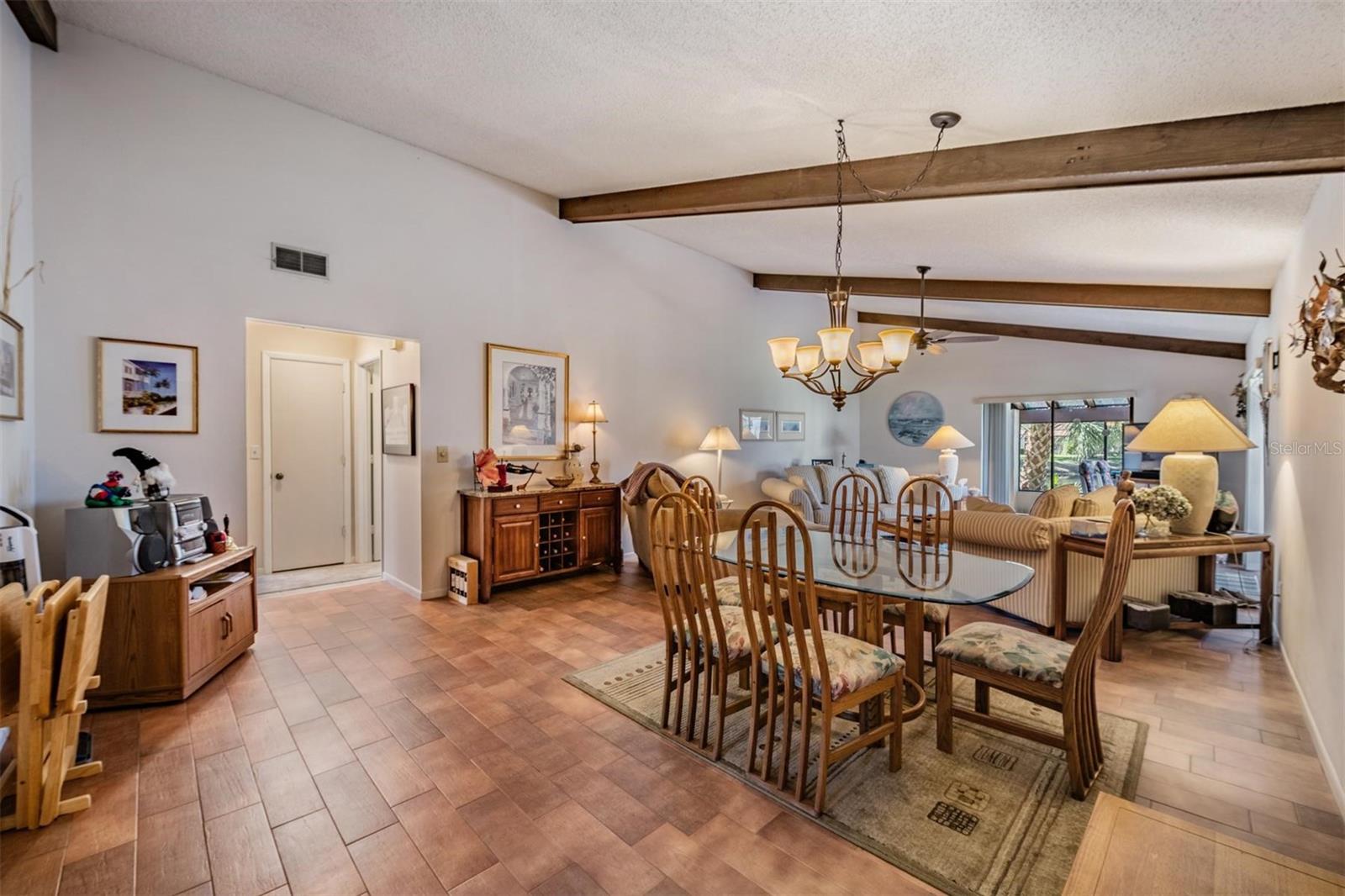 Living Room and Dining Area w/vaulted ceilings
