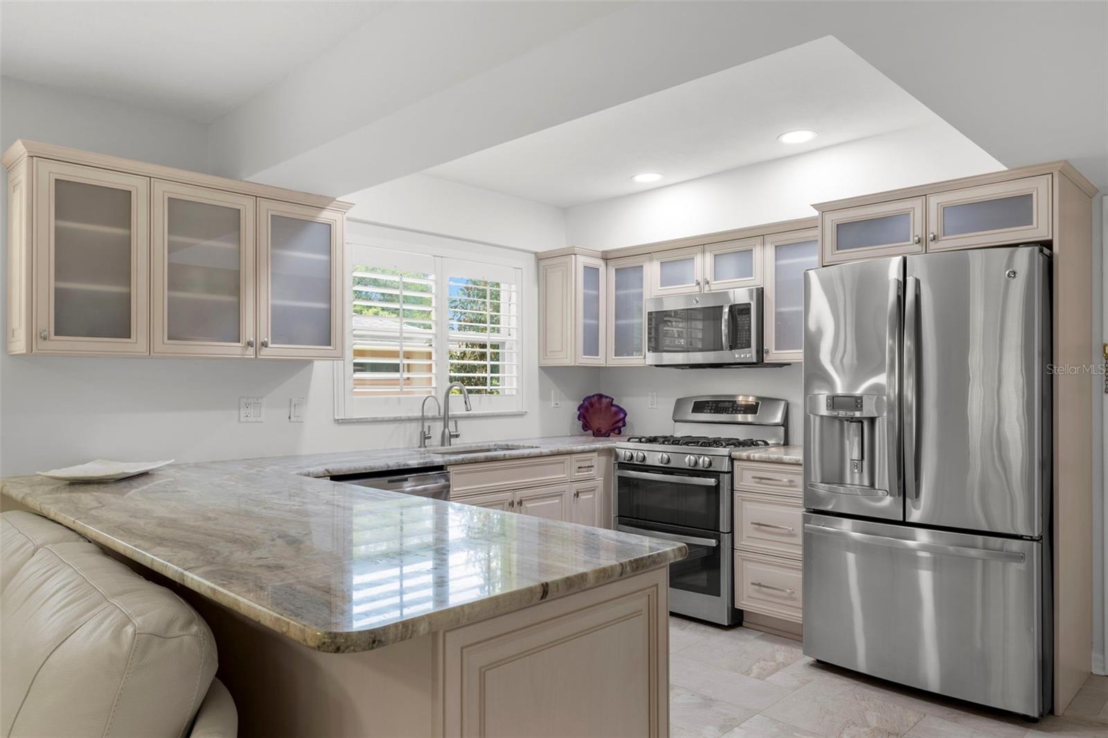 BEAUTIFUL UPDATED KITCHEN WITH ALL GE APPLIANCES WITH LOTS OF STORAGE AND LAUNDRY ROOM ACCESS TO GARAGE