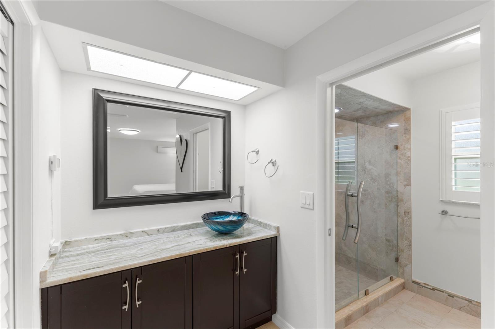 MASTER BATHROOM WITH WALK IN SHOWER, TOILET AND WALK IN CLOSET