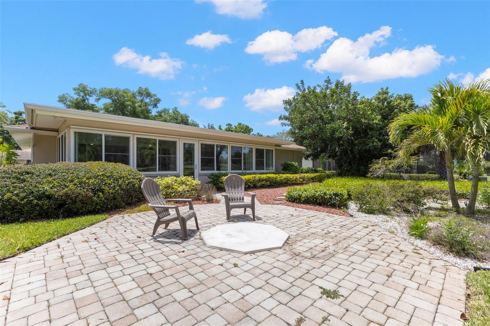 VIEW OF BACK OF PROPERTY WITH LOTS OF LIGHTS AND SHUTTERS FOR PRIVACY - GENERAC INCLUDED