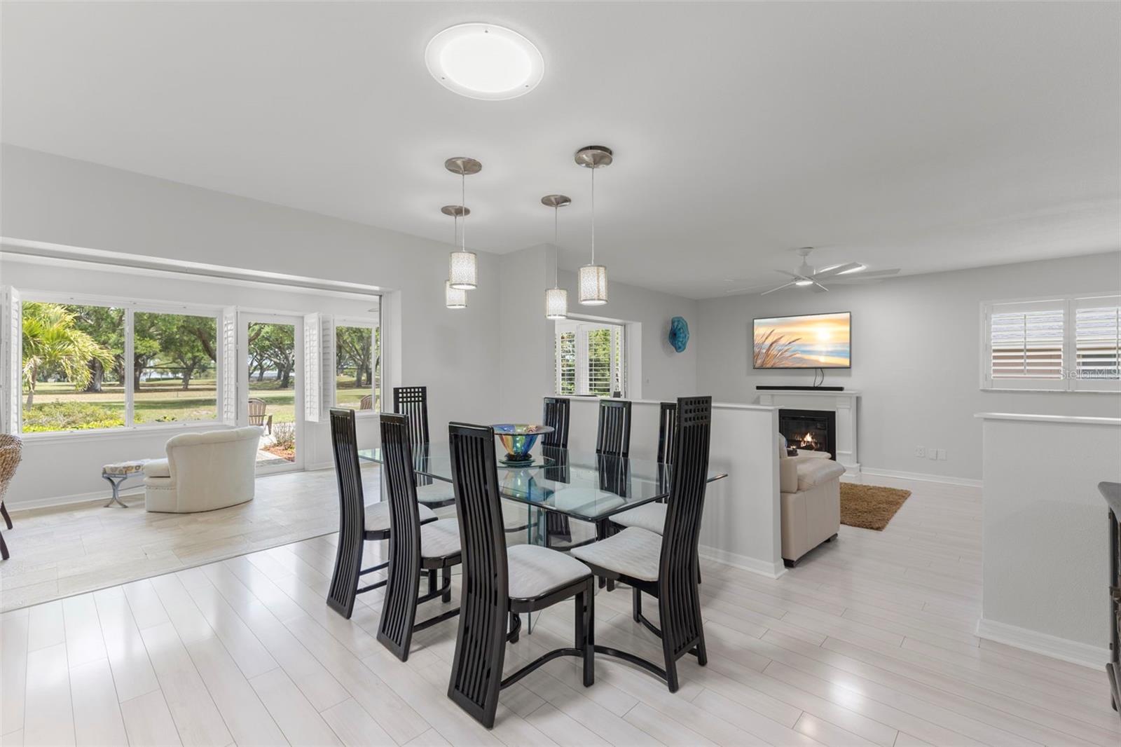 FROM LIVING ROOM VIEWING THE 6TH FAIRWAY THRU THE FRONT, BACK PORCH, FAMILY ROOM AND DINING ROOM