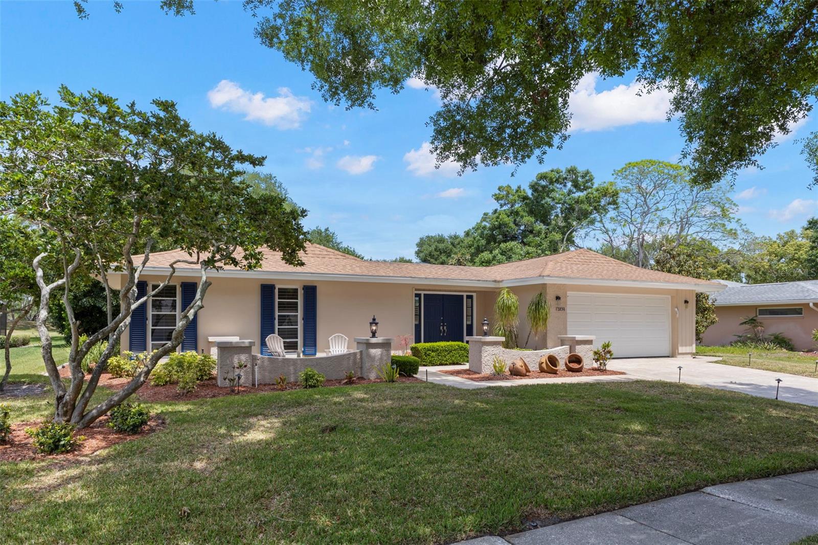 VIEW OF FRONT PROPERTY AND SITTING AREA, 2 CAR GARAGE, DOUBLE FRONT DOOR