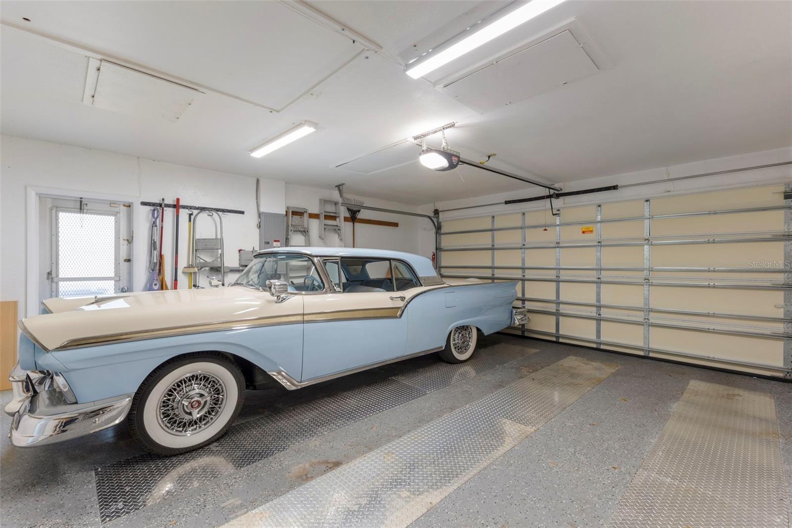 2 CAR GARAGE WITH NEW GARAGE DOOR, OPENER AND EXIT TO SIDE OF PROPERTY. LOTS OF STORAGE IN ATTIC AND SIDE WALLS