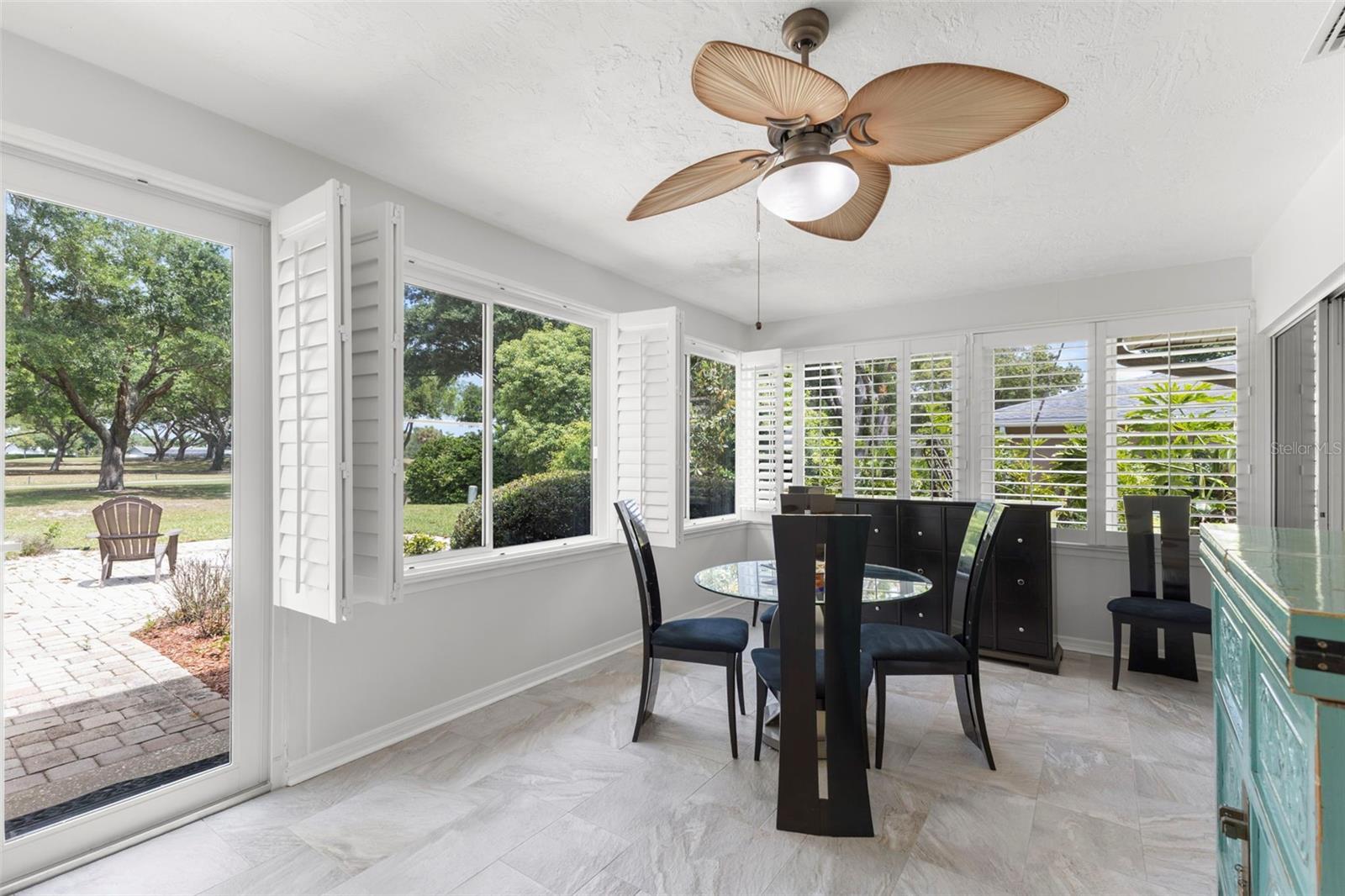 VIEW FROM THE THE PORCH AND BACK PAVED PORCH WITH XERSCAPE BACKYARD.