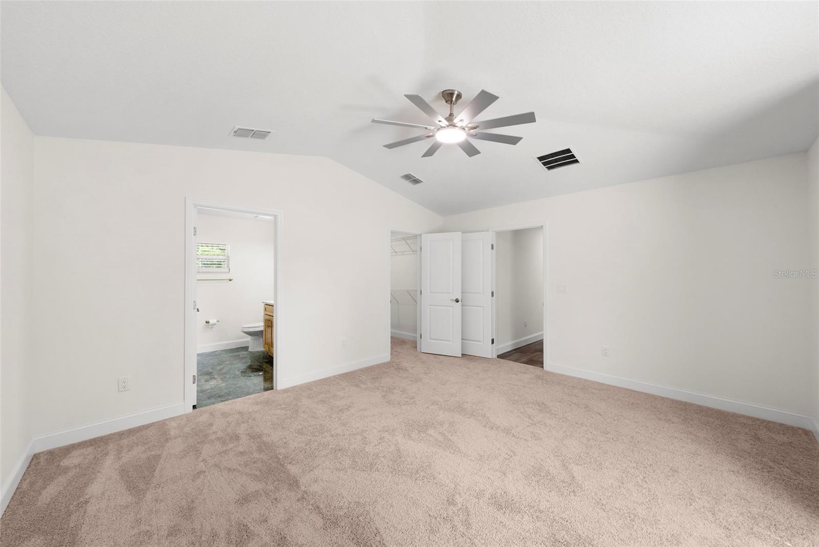 Primary Bedroom: Left Door - Ensuite Bathroom, Center - Walk-In Closet, Left Door - Hallway