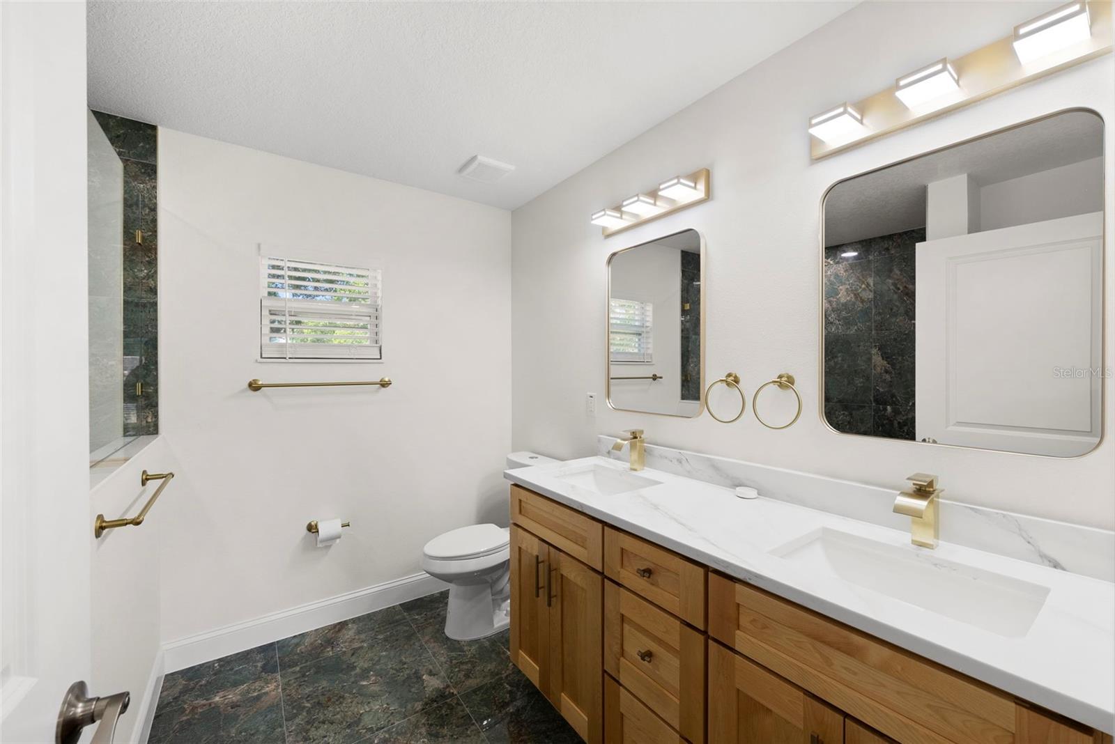 Primary Ensuite Bathroom with Dual Sinks