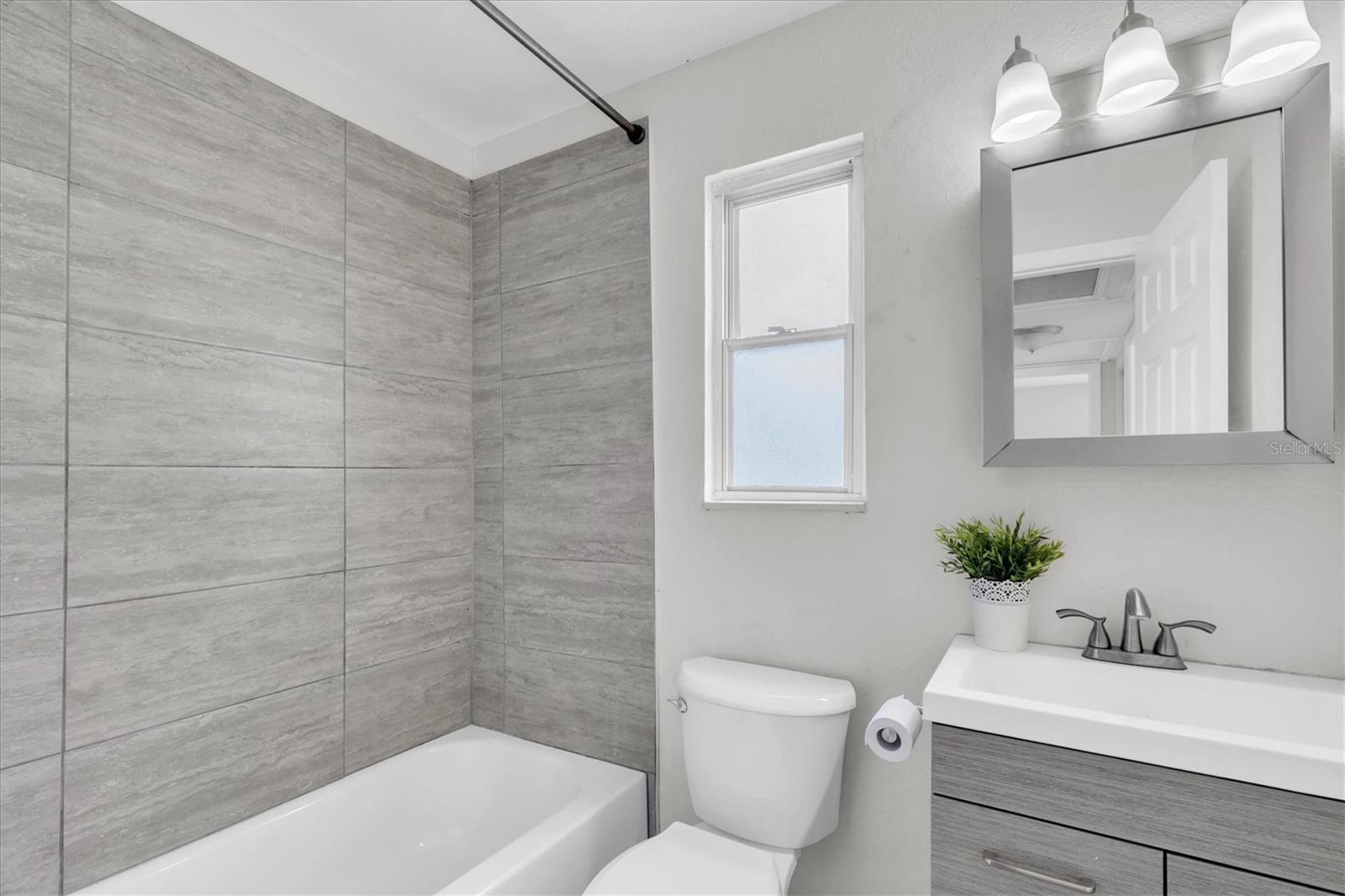 Bathroom w/ Tub and Rainfall Showerhead