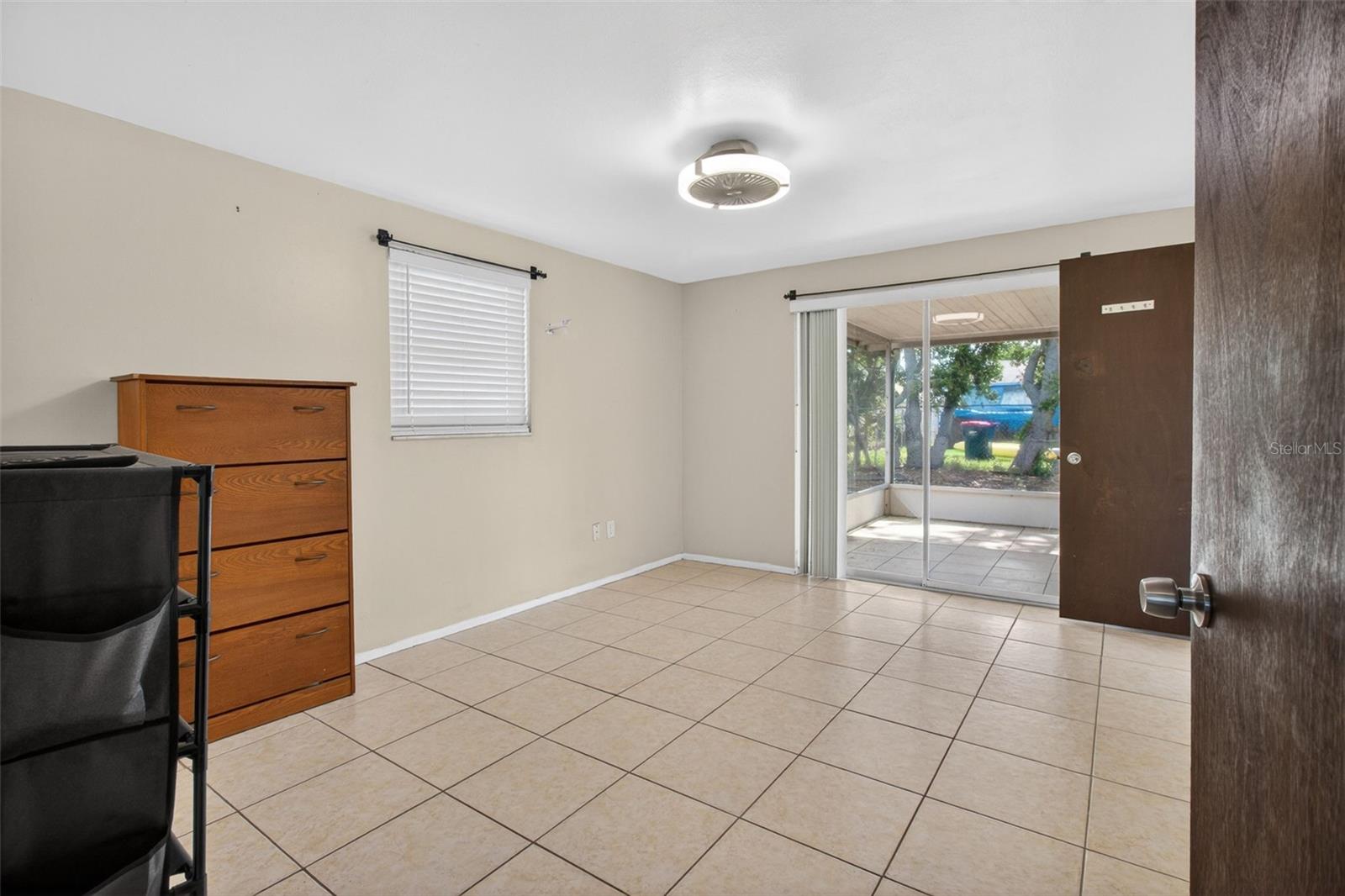 Primary Bedroom with view of Patio