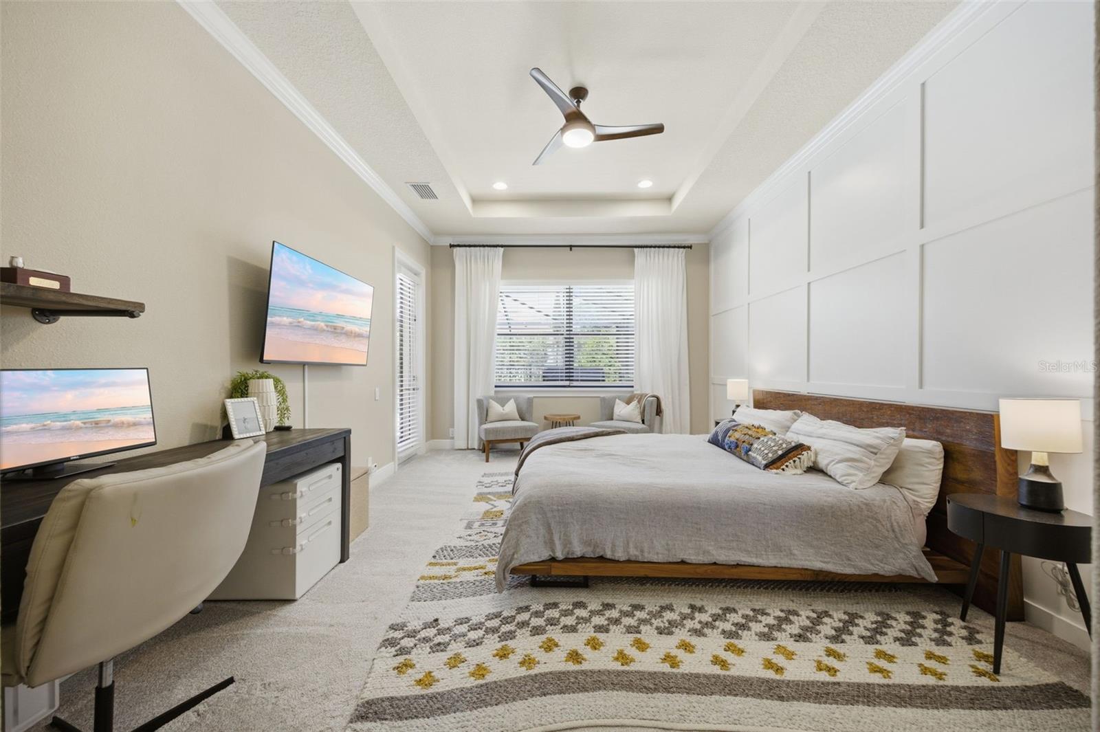 Main floor primary suite with private door to pool area.