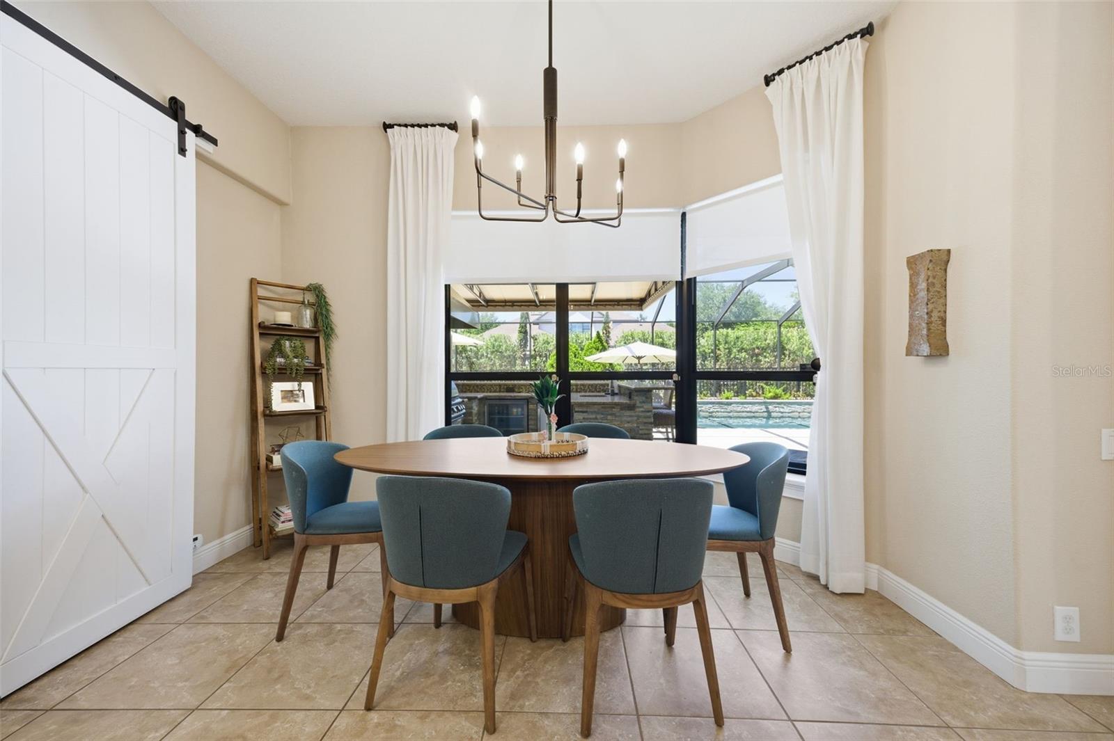 Kitchen dining area with custom barn door.