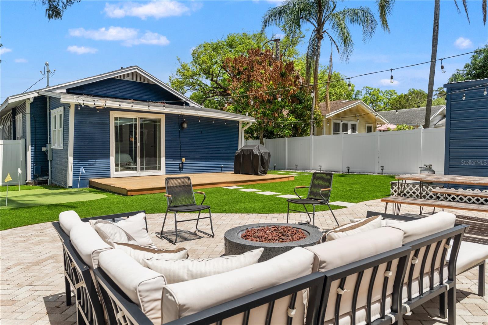 All turf & paver backyard