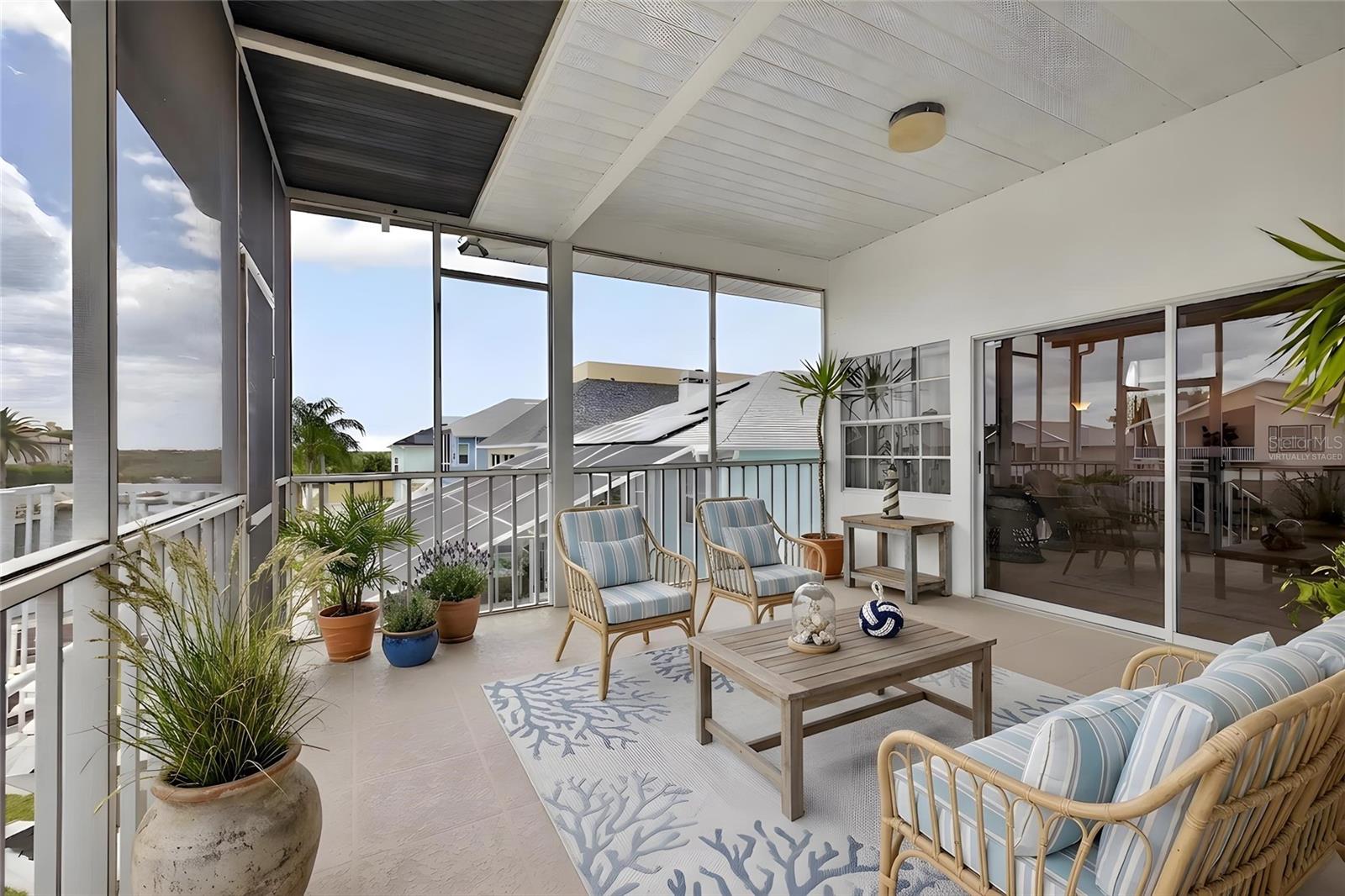Virtual-Upper waterfront balcony screened deck.