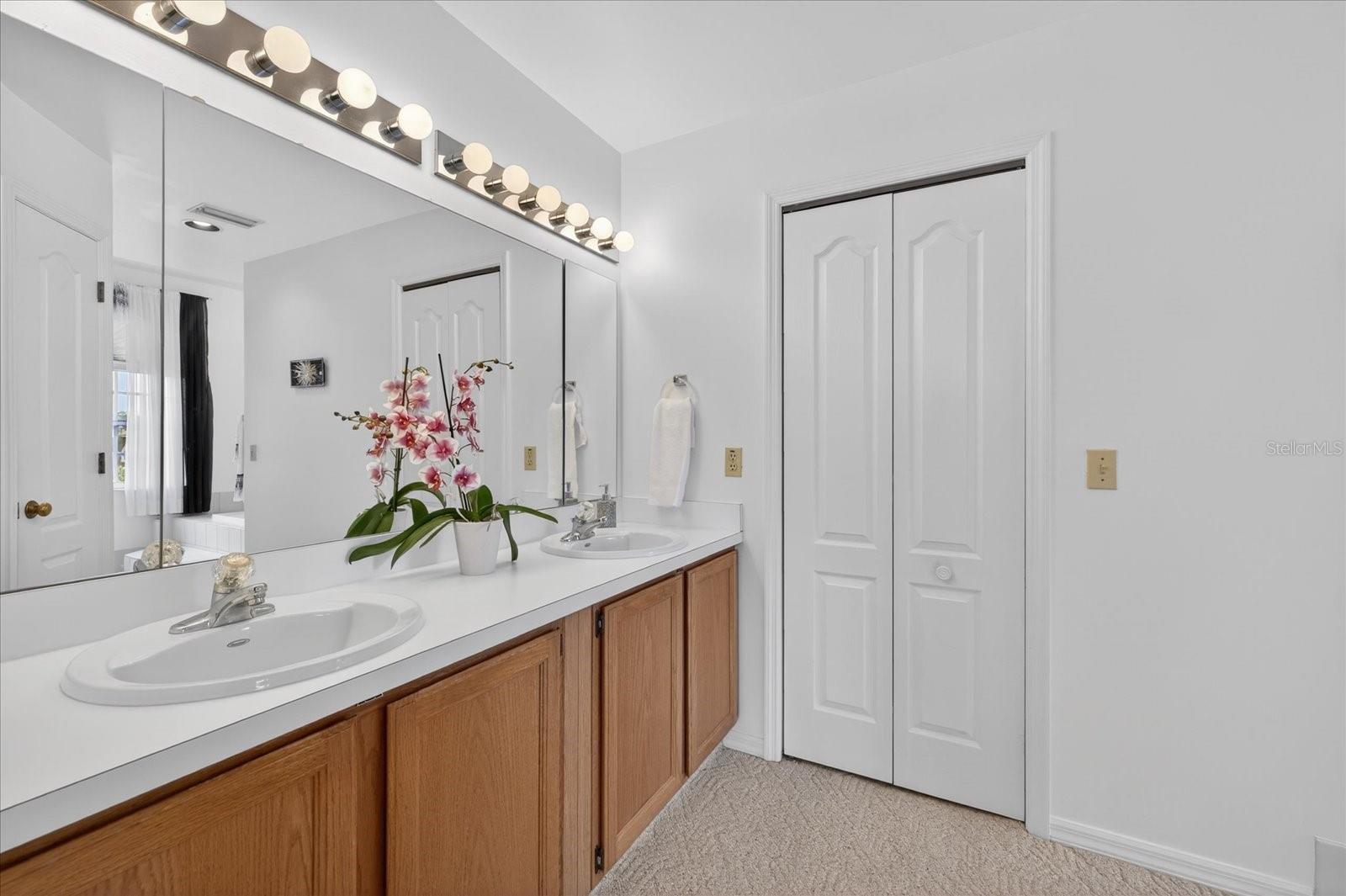 Primary ensuite double vanity and walk in closet