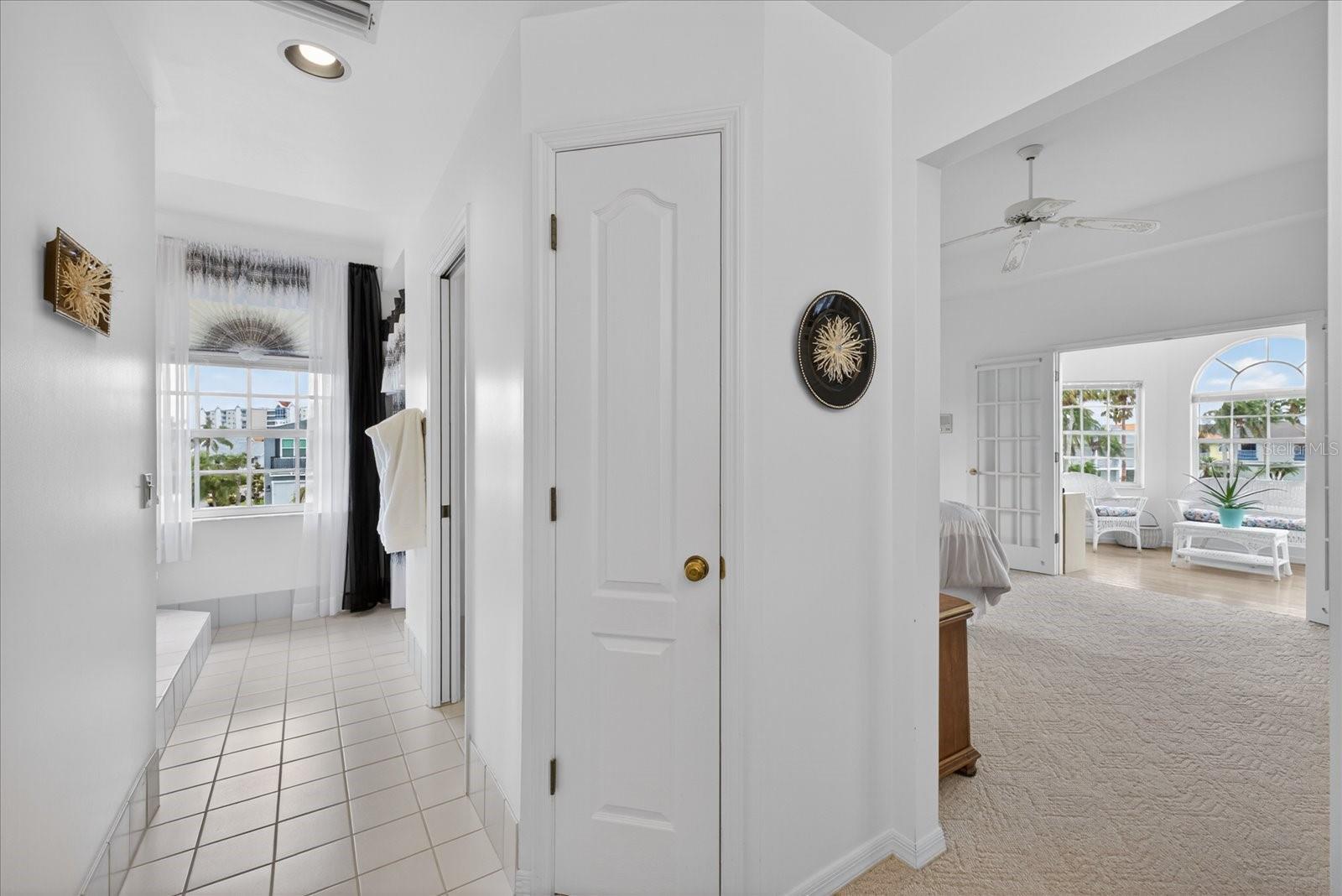 Primary ensuite with linen storage closet