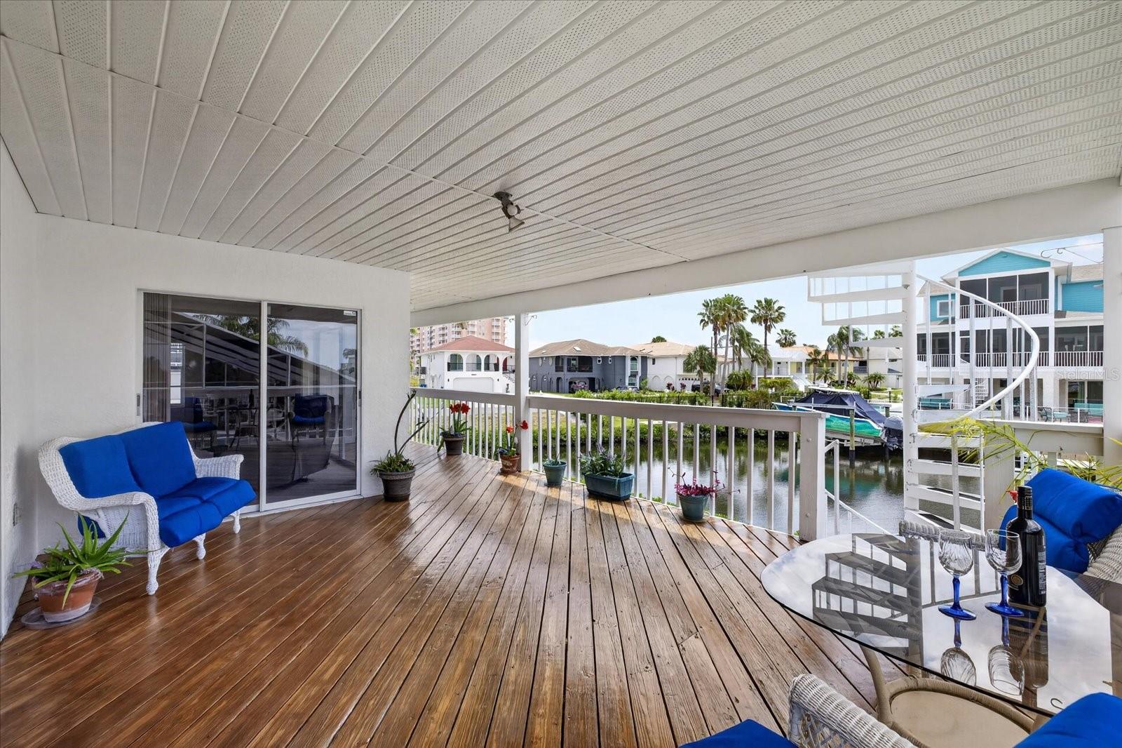 Sliders from family room to lower balcony and spiral stairs to upper balcony.