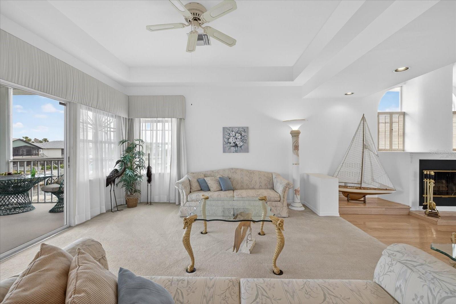 Main living room on upper floor with water views.