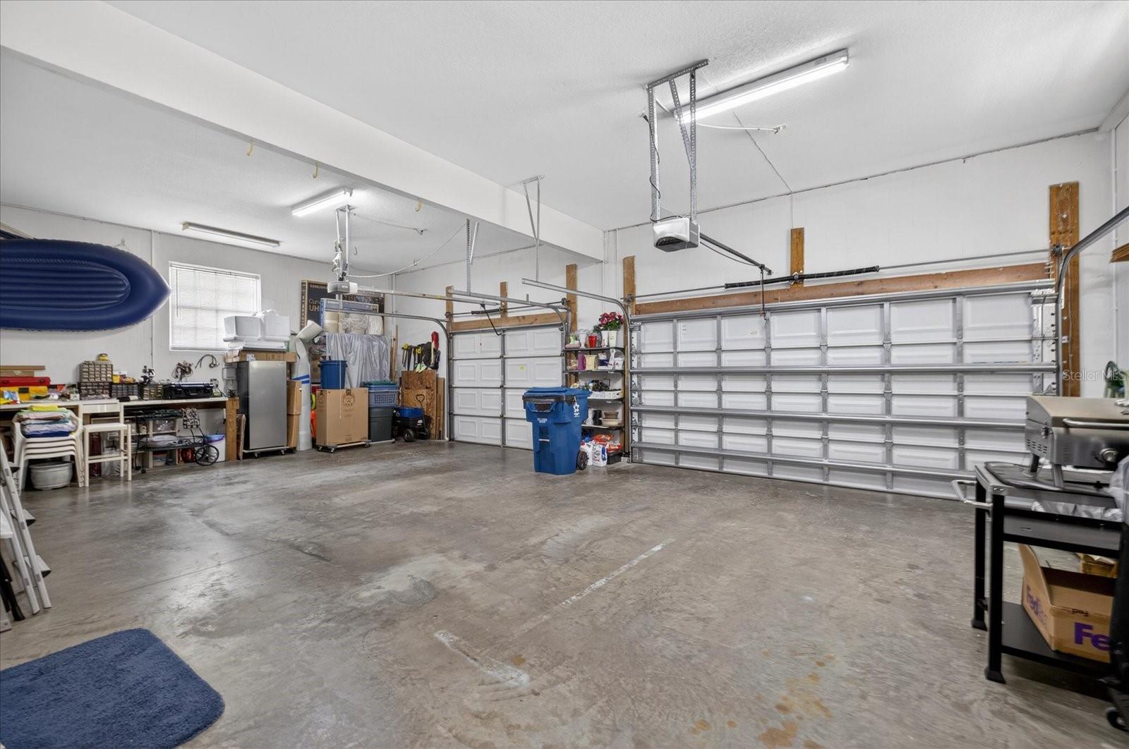 Spacious 3 car garage with two automatic doors