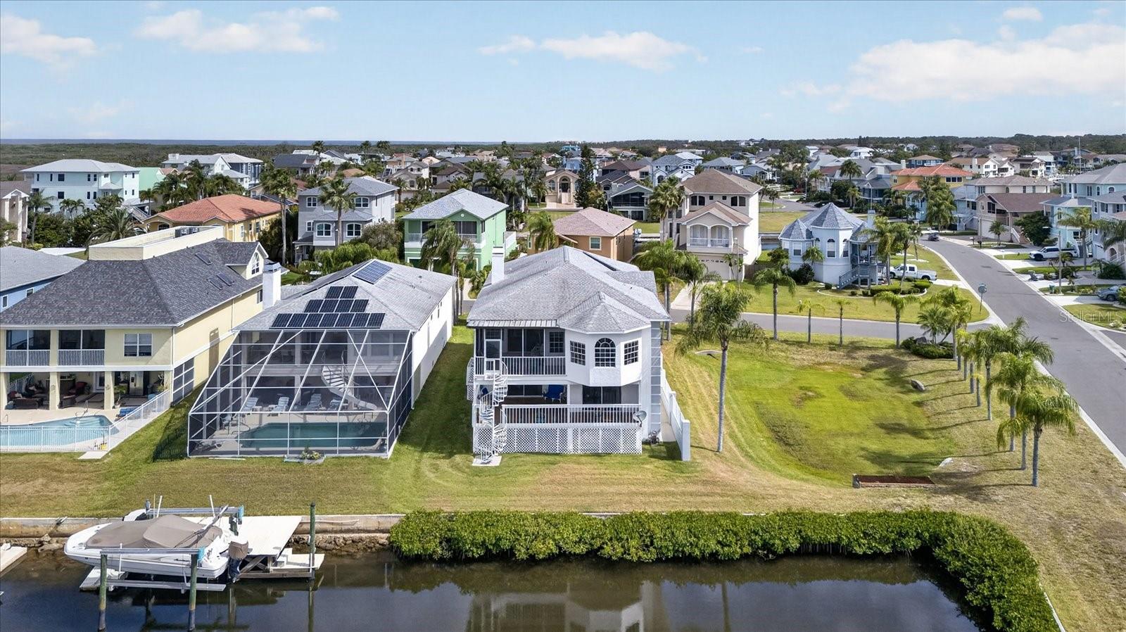 Home lot with seawall extending around corner