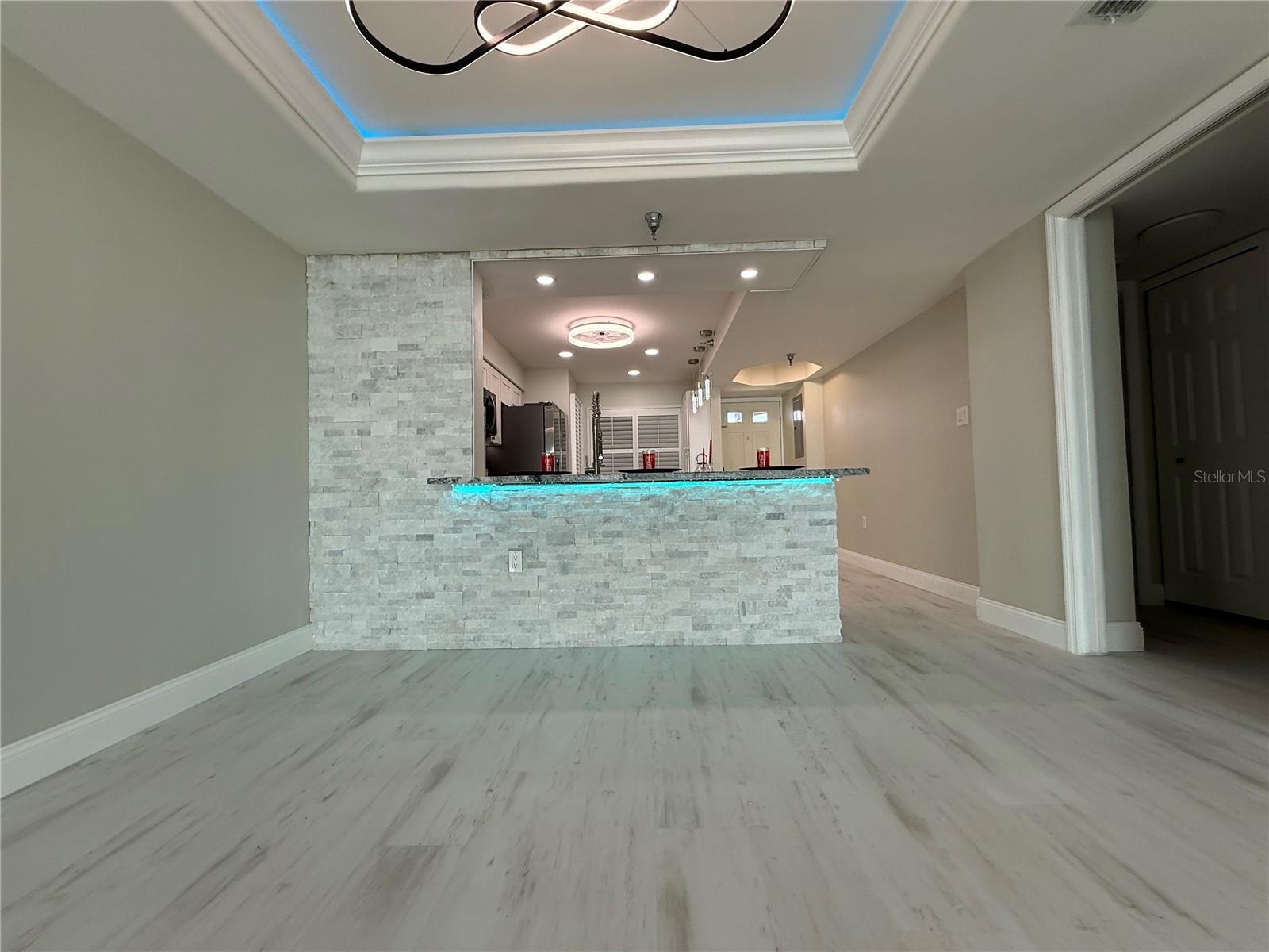 Dining Room/Living Rool with View of Kitchen and Accent Under-counter Lighting