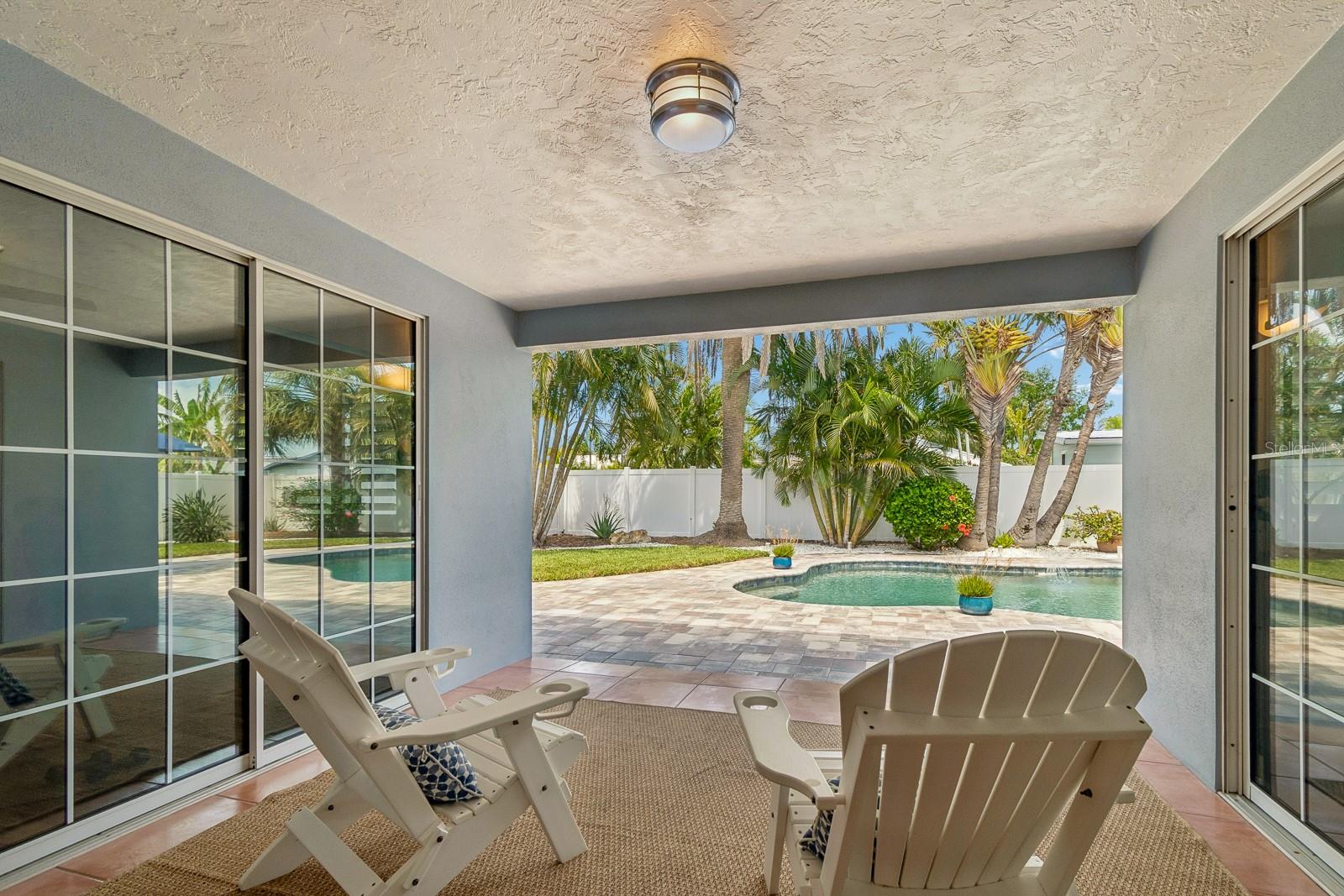 Covered lanai overlooking private pool retreat