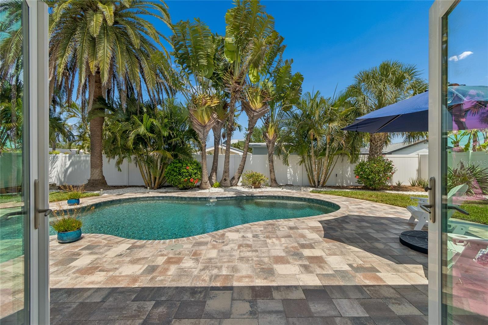 Resort-style pool in private tropical oasis