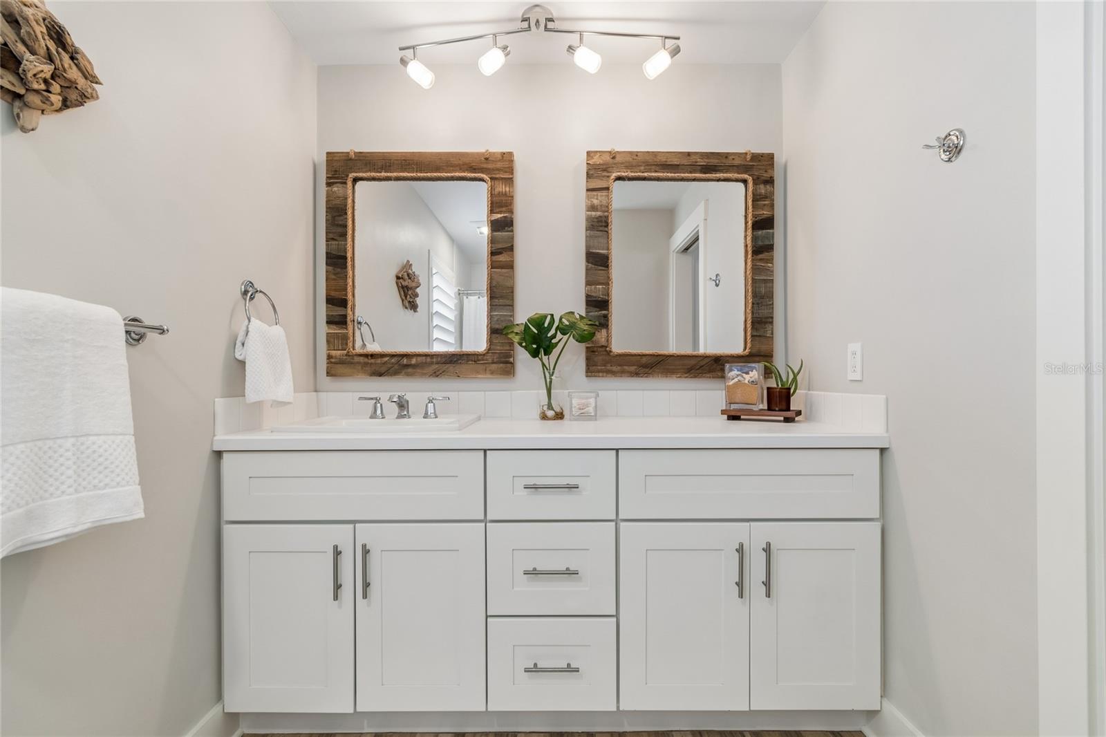 Updated bath with dual vanity, modern finishes