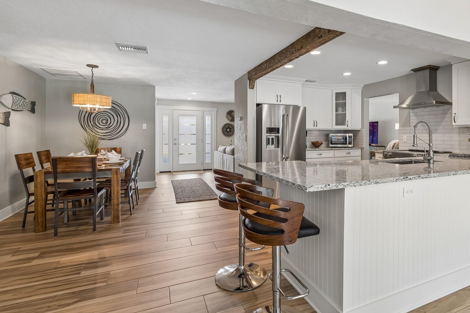 Chef’s kitchen with quartz island, custom cabinetry
