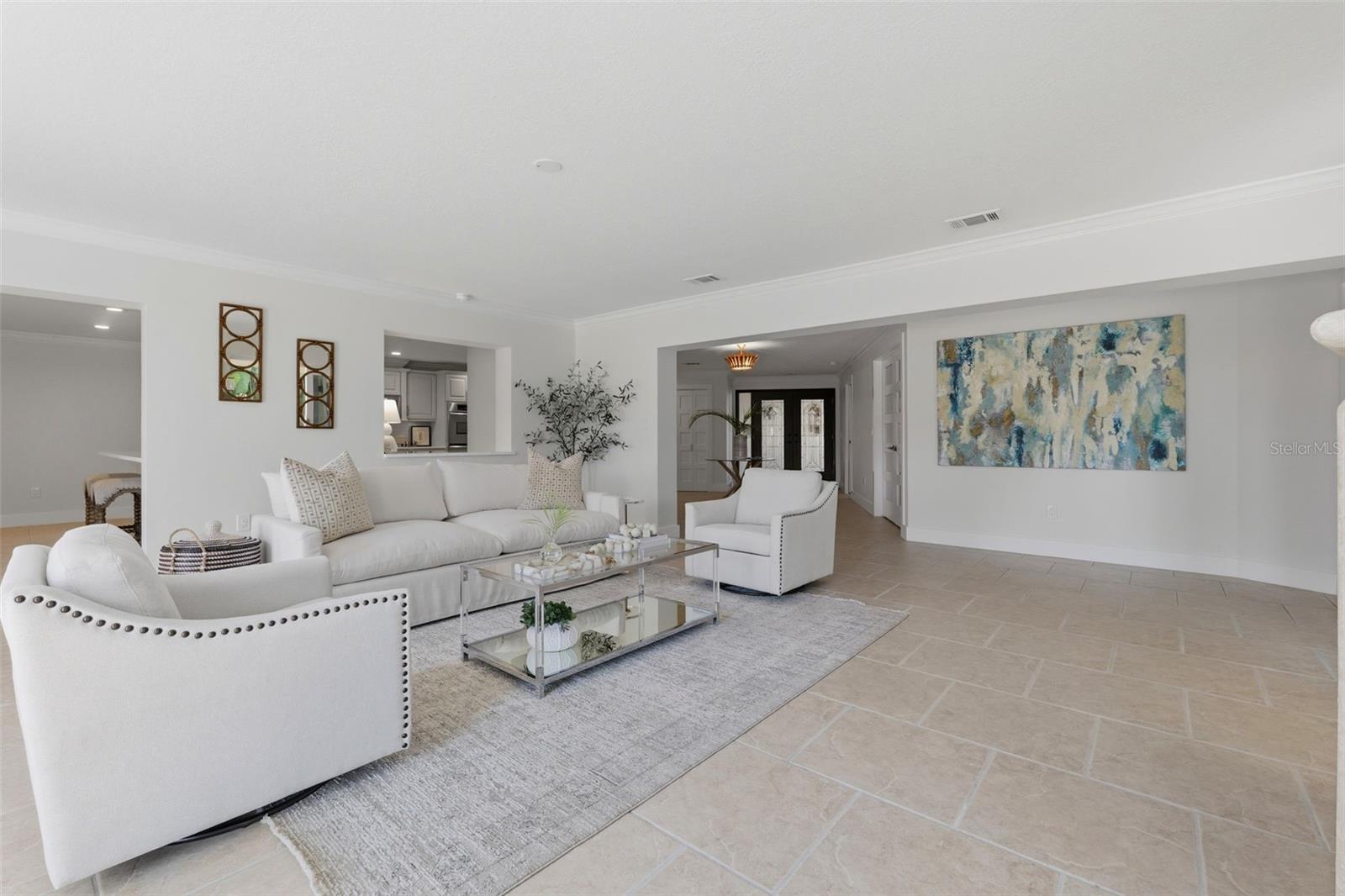 Living room with gas fireplace and sliders to pool