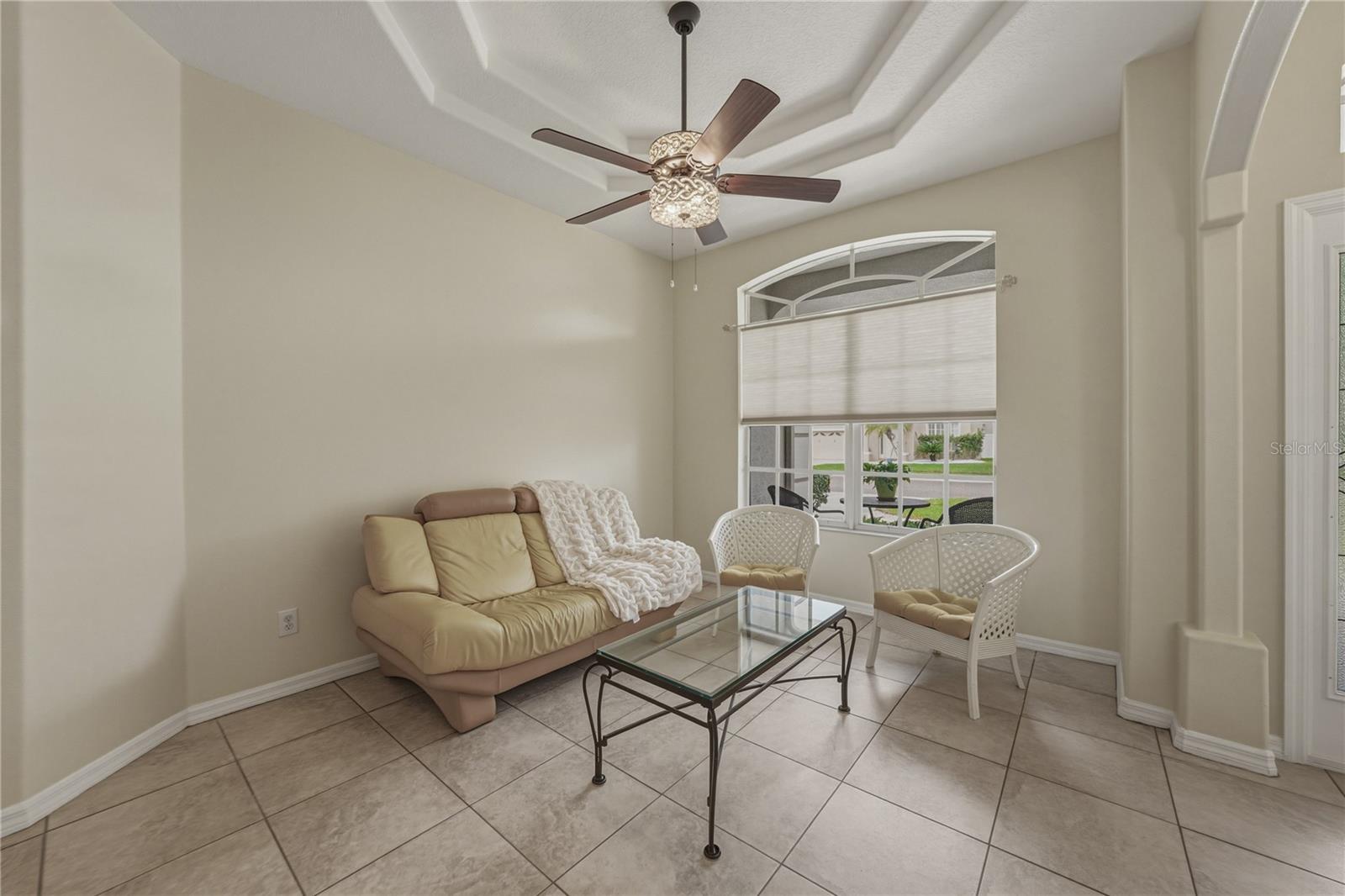 A versatile front room ideal for a home office, sitting area, or stylish space to gather and entertain.