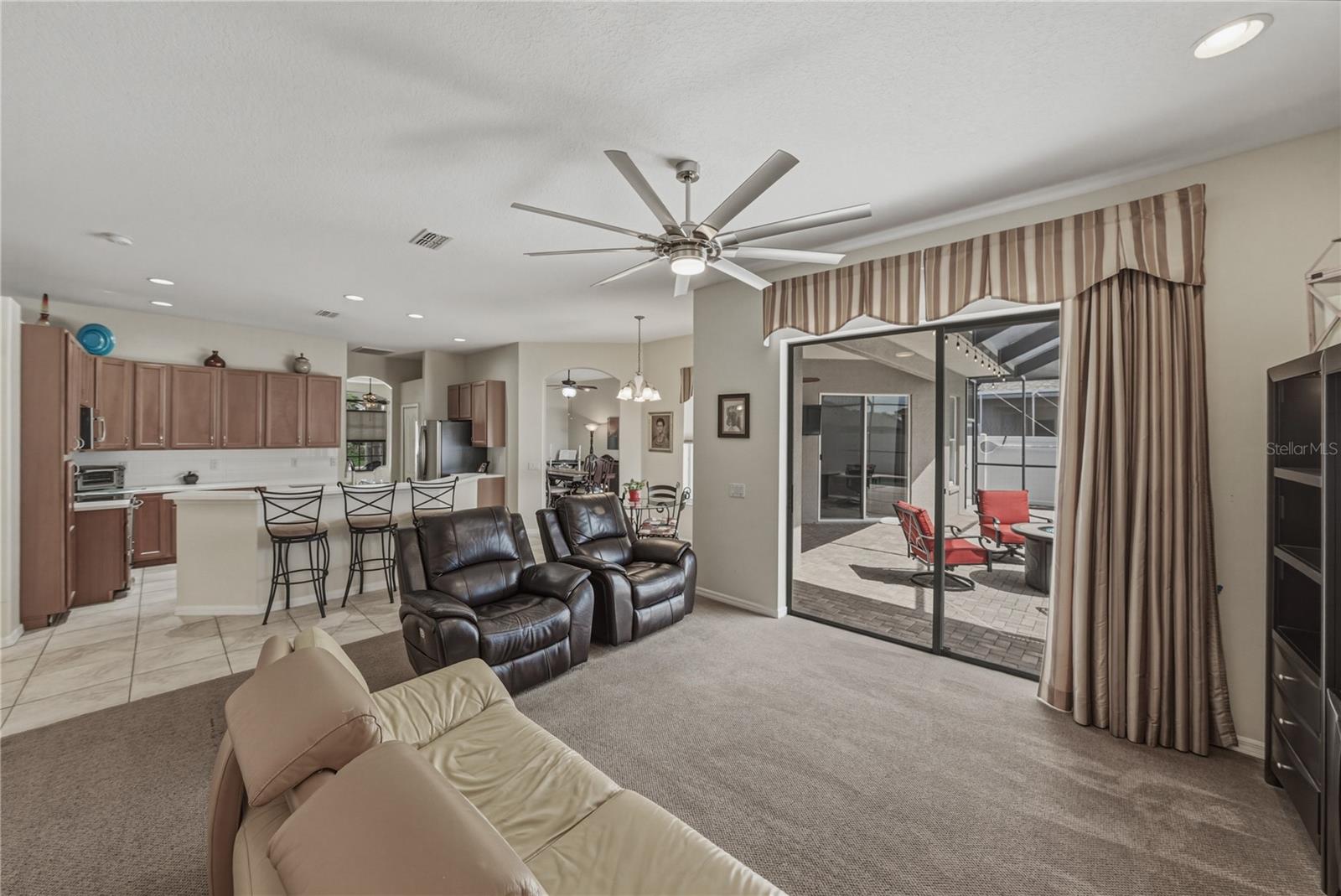 Spacious family room with seamless indoor-outdoor flow to the pool, perfect for entertaining, relaxing, and everyday living.