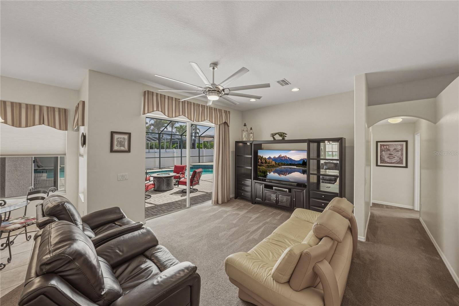 Spacious family room with seamless indoor-outdoor flow to the pool, perfect for entertaining, relaxing, and everyday living.