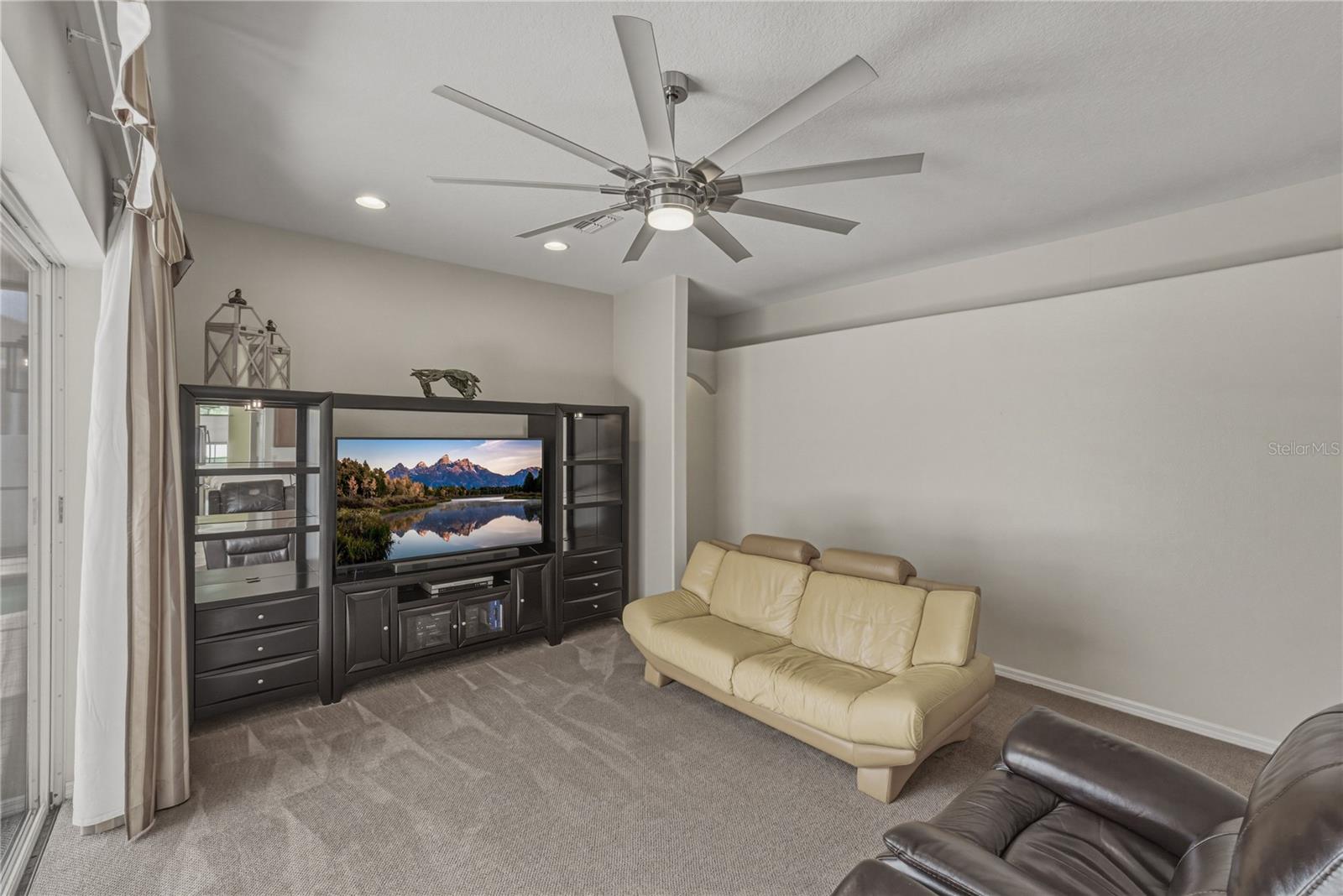 Spacious family room with seamless indoor-outdoor flow to the pool, perfect for entertaining, relaxing, and everyday living.