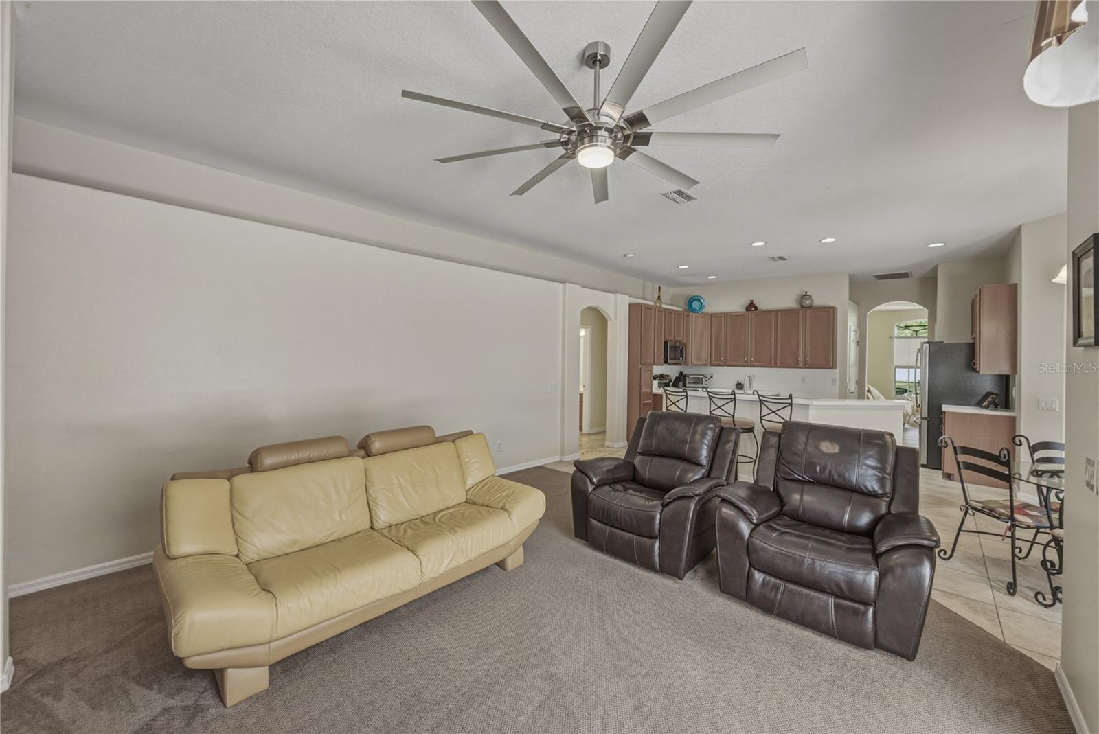 Spacious family room with seamless indoor-outdoor flow to the pool, perfect for entertaining, relaxing, and everyday living.