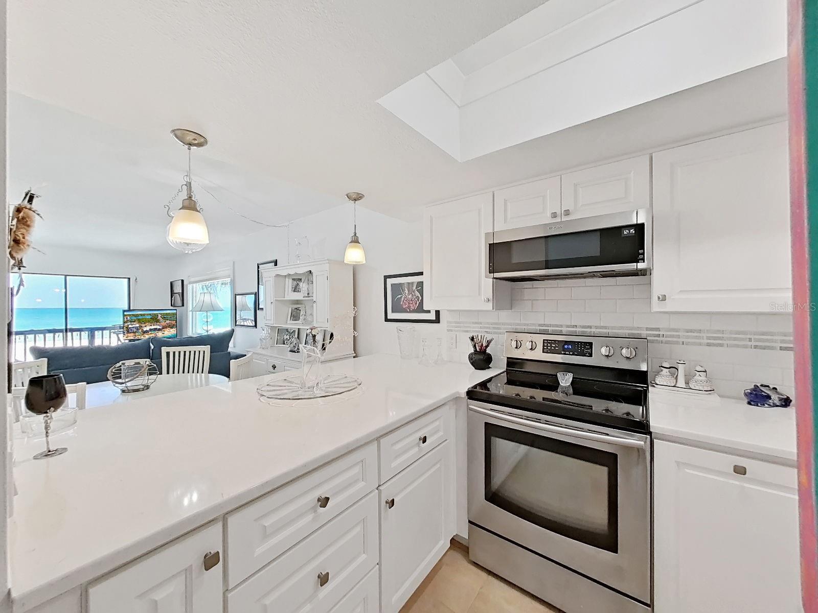 •Stainless steel appliances & modern coastal white cabinets