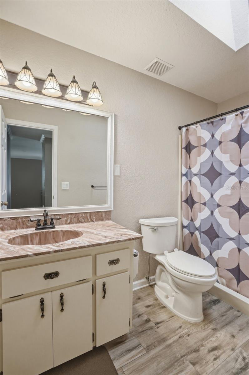 Primary EnSuite Bathroom with oversized Vanity Sink Area in Dressing Room between Bedroom and Bathroom