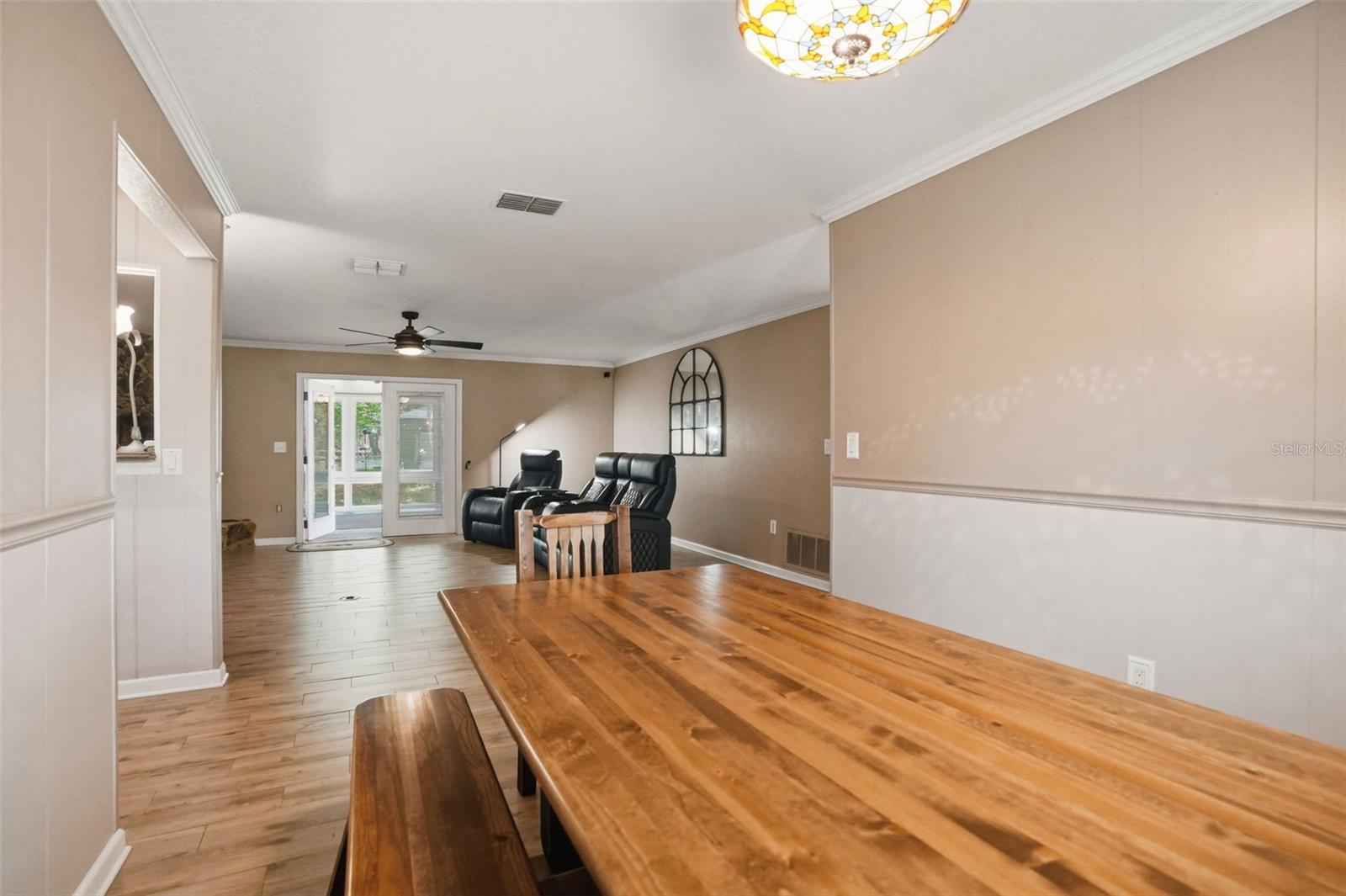 Dining Room open to Living Room with Wood-Look Tile Floors