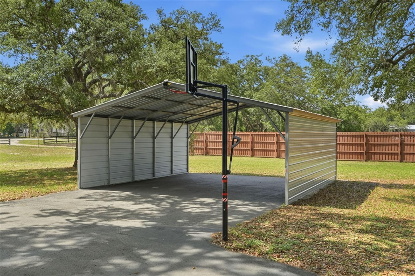 24 x 25 x 8 Double Wide Carport with Enclosed Sides.  3 Acres, 3/2/2 Single Family Home, 2/2 Manufactured Home, Shed, Barn, Gazebo, Sunroom, and Screen Enclosed Hot Tub. Zoned AR, bring your farm animals, store your boat and RV, potential to build another home on the property!